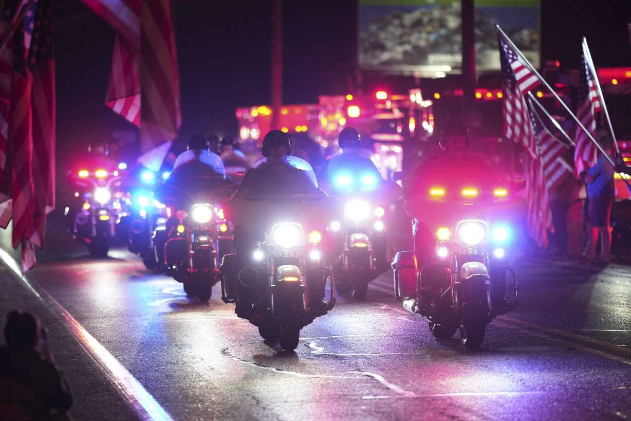 Police officers during a procession Wednesday in Spring Grove, Pa. Three police officers were fatally shot and two were wounded Wednesday in southern Pennsylvania, and the shooter was killed by police, authorities said.