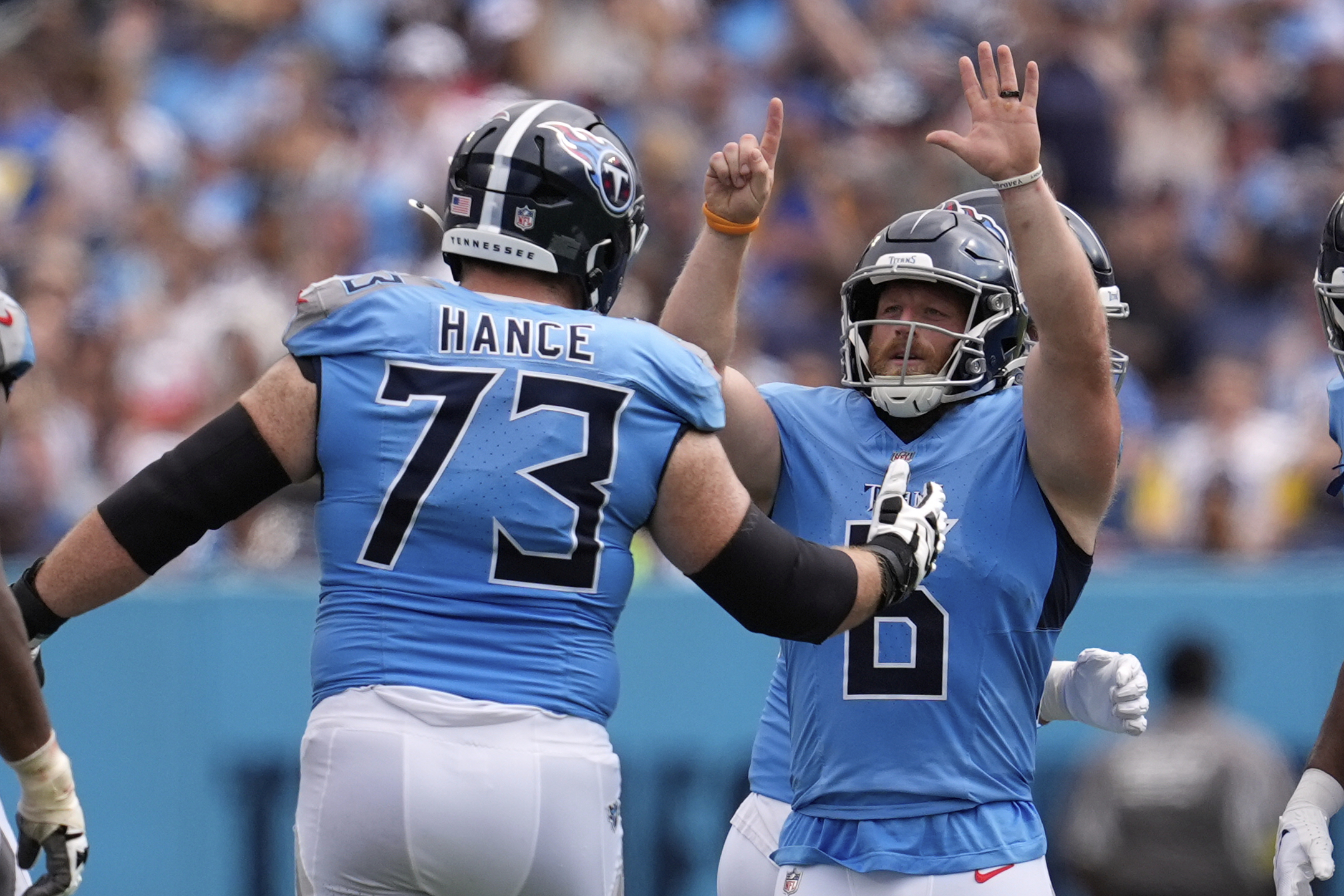 Tennessee Titans place kicker Joey Slye, right, celebrates a field goal with guard Blake Hance during the second half of an NFL football game against the Los Angeles Rams, Sunday, Sept. 14, 2025, in Nashville, Tenn. 