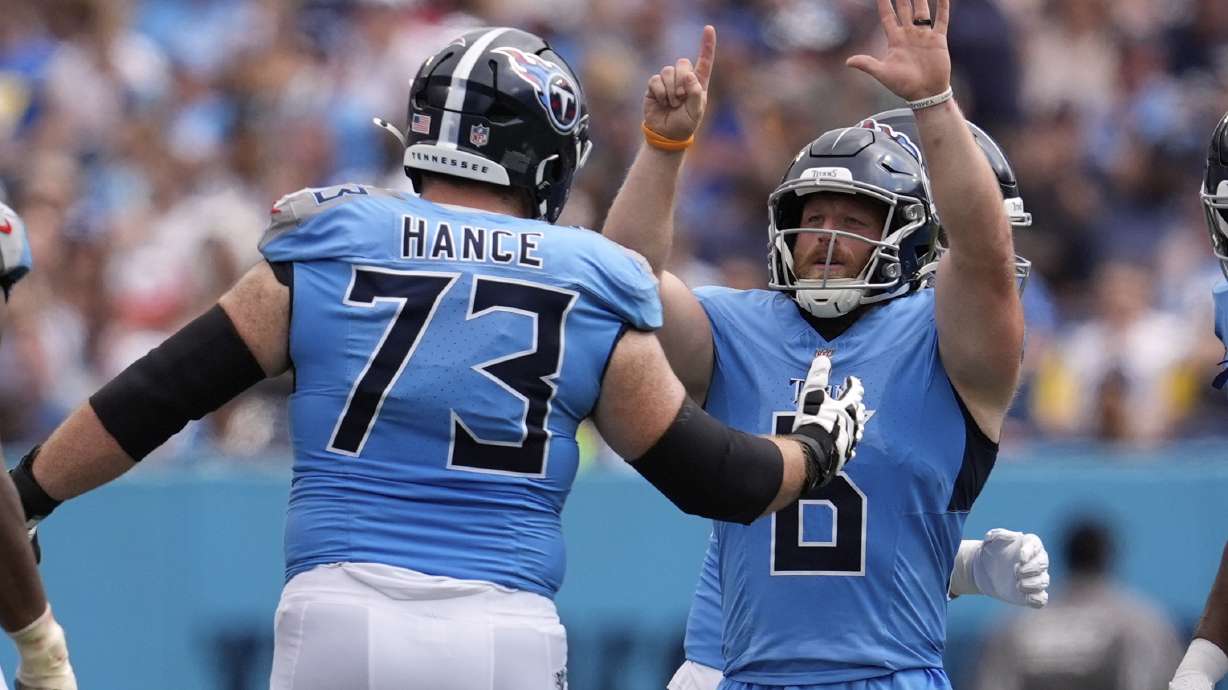 Tennessee Titans place kicker Joey Slye, right, celebrates a field goal with guard Blake Hance during the second half of an NFL football game against the Los Angeles Rams, Sunday, Sept. 14, 2025, in Nashville, Tenn.