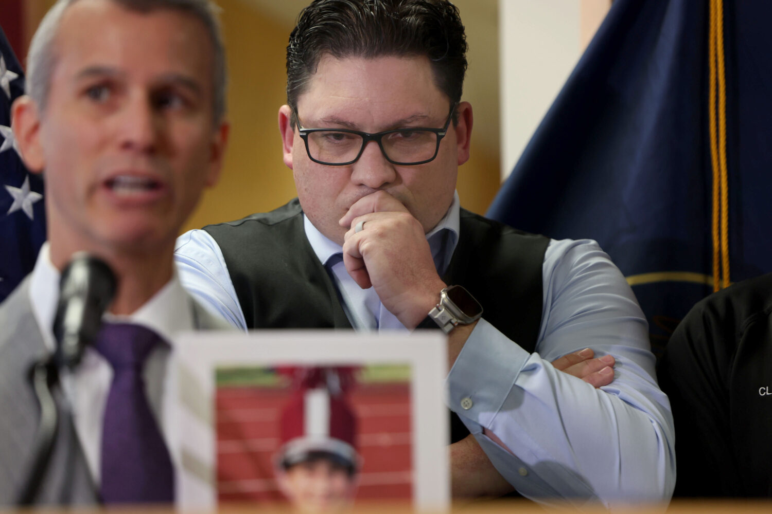 Rep. Ryan Wilcox, right, listens during the signing of HB 84, School Safety Amendments, at the University of Utah Bennion Center in Salt Lake City on April 10, 2024.