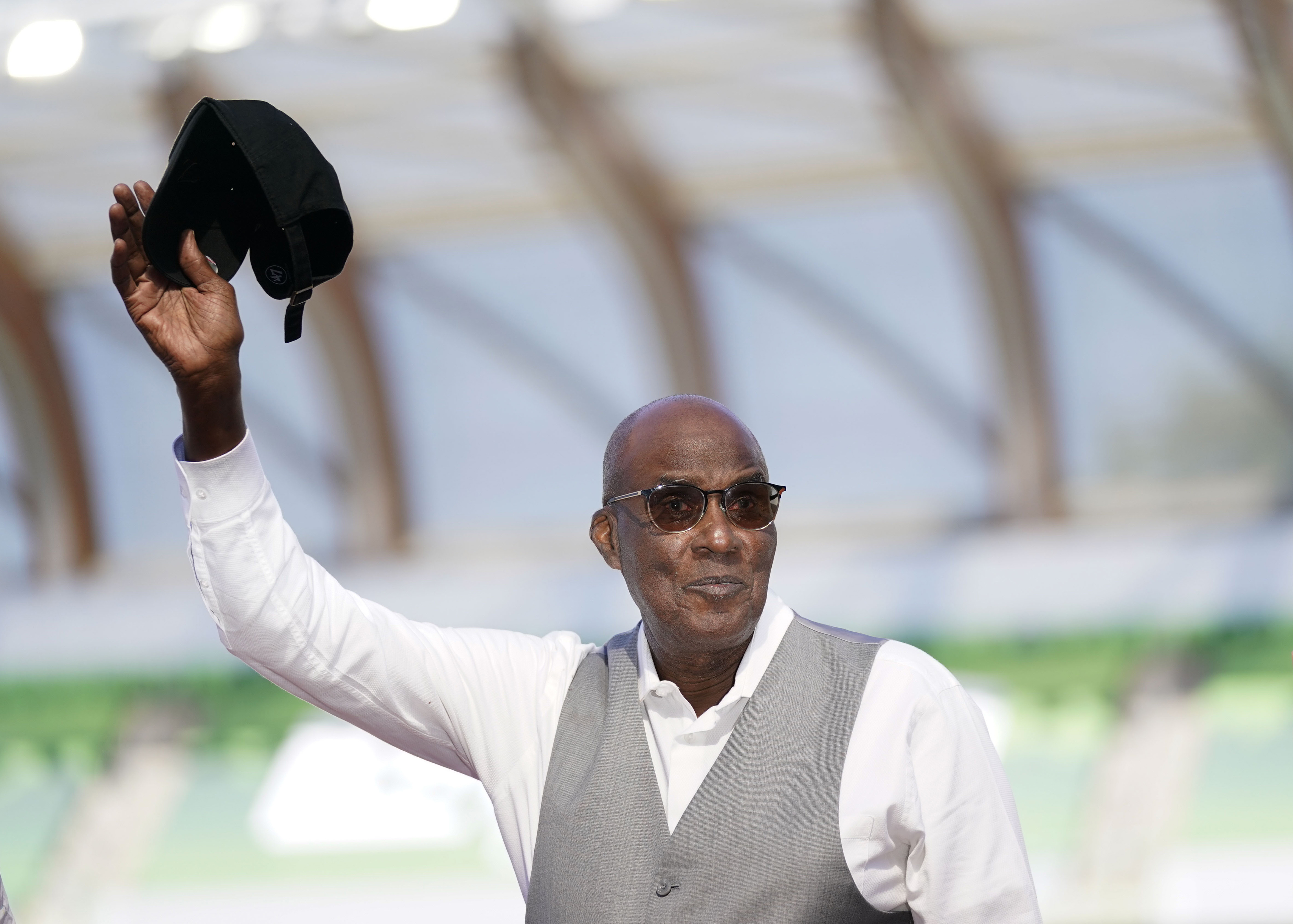 FILE - Bobby Kersee holds up his hat as he is honored as the 2023 USATF Legend Coach of the Year the during the U.S. track and field championships in Eugene, Ore., Saturday, July 8, 2023. 