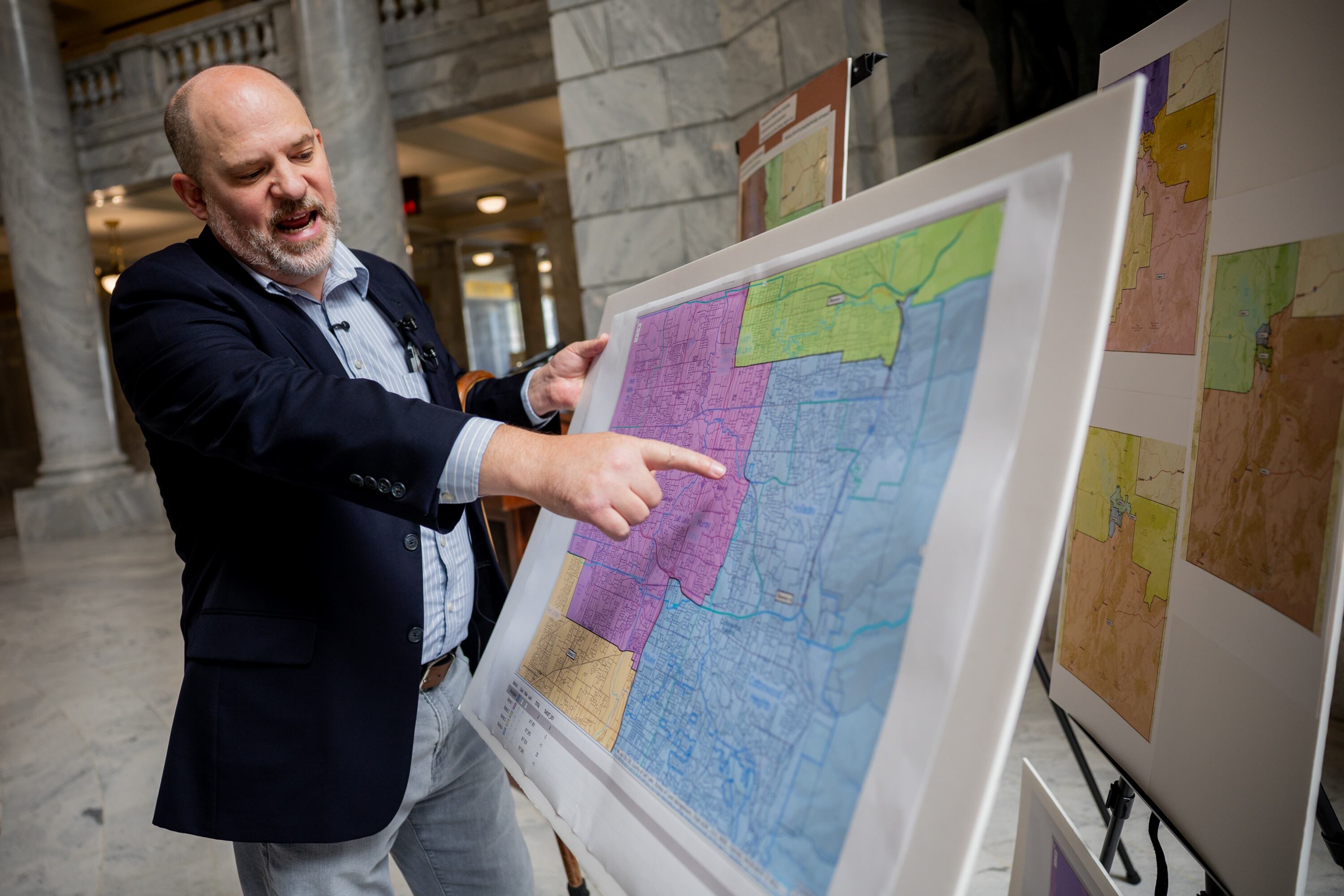 Utah Sen. Dan Thatcher, Forward Party of Utah, shows a zoomed-in version of a map of the Wasatch Front as he talks through the details of a congressional map of his authorship during a press conference at the Utah Capitol in Salt Lake City on Wednesday.
