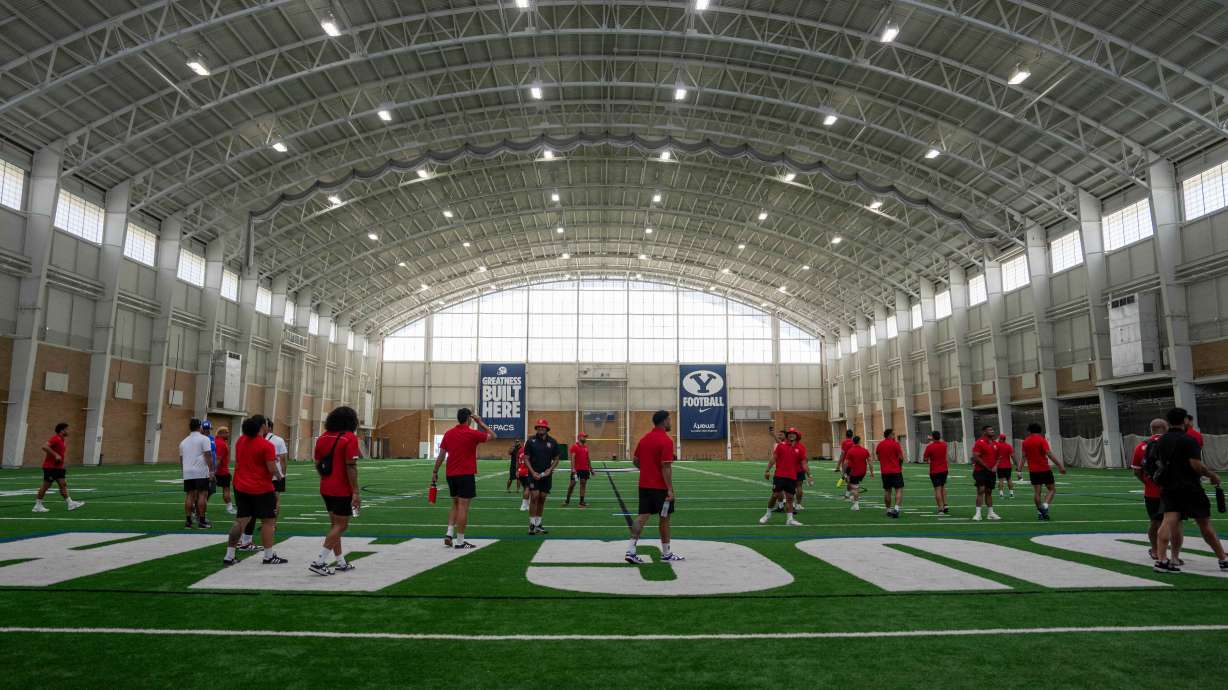 Members of the Tongan national rugby team with BYU football coach Kalani Sitake, who was the first Tongan-born head coach in NCAA Division I football, Tuesday, Sept. 16, 2025 in Provo, Utah.