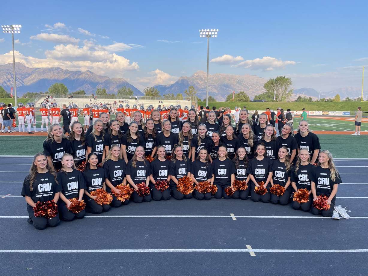 Skridge cheerleaders with "fight with Cru" shirts at a game this season.
