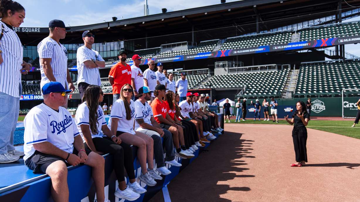 Major League Baseball Home Run Derby X participants listen to Michelle Smith, president of Miller Sports + Entertainment, before a media day at The Ballpark at America First Square on Thursday.