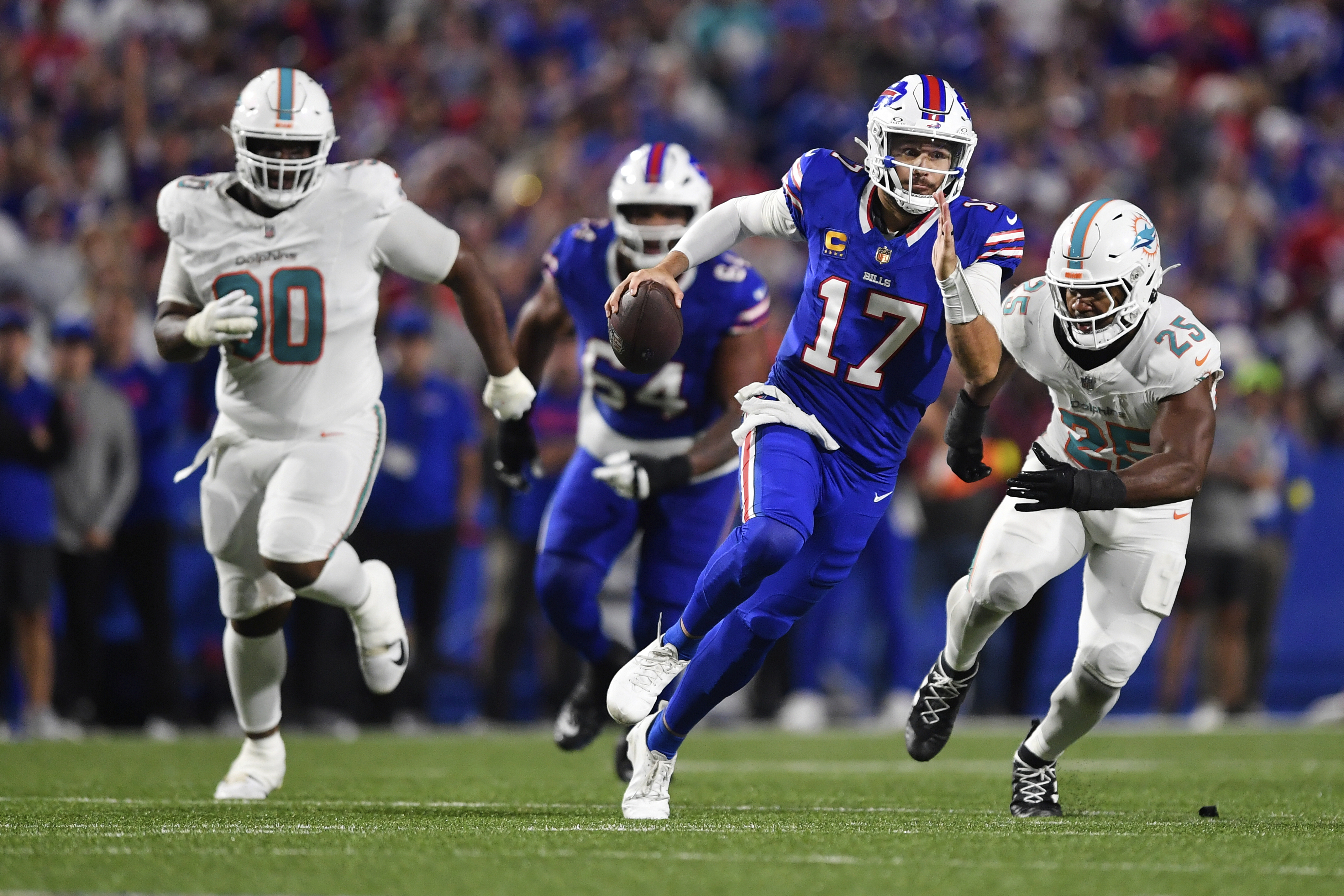 Buffalo Bills quarterback Josh Allen (17) runs what the ball during the second half of an NFL football game against the Miami Dolphins, Thursday, Sept. 18, 2025, in Orchard Park, N.Y. 