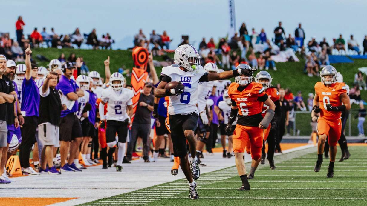 Lehi's Legend Glasker runs for a 45-yard touchdown during a high school football game at Skyridge High in Lehi, Utah, Thursday, Sept. 18, 2025.