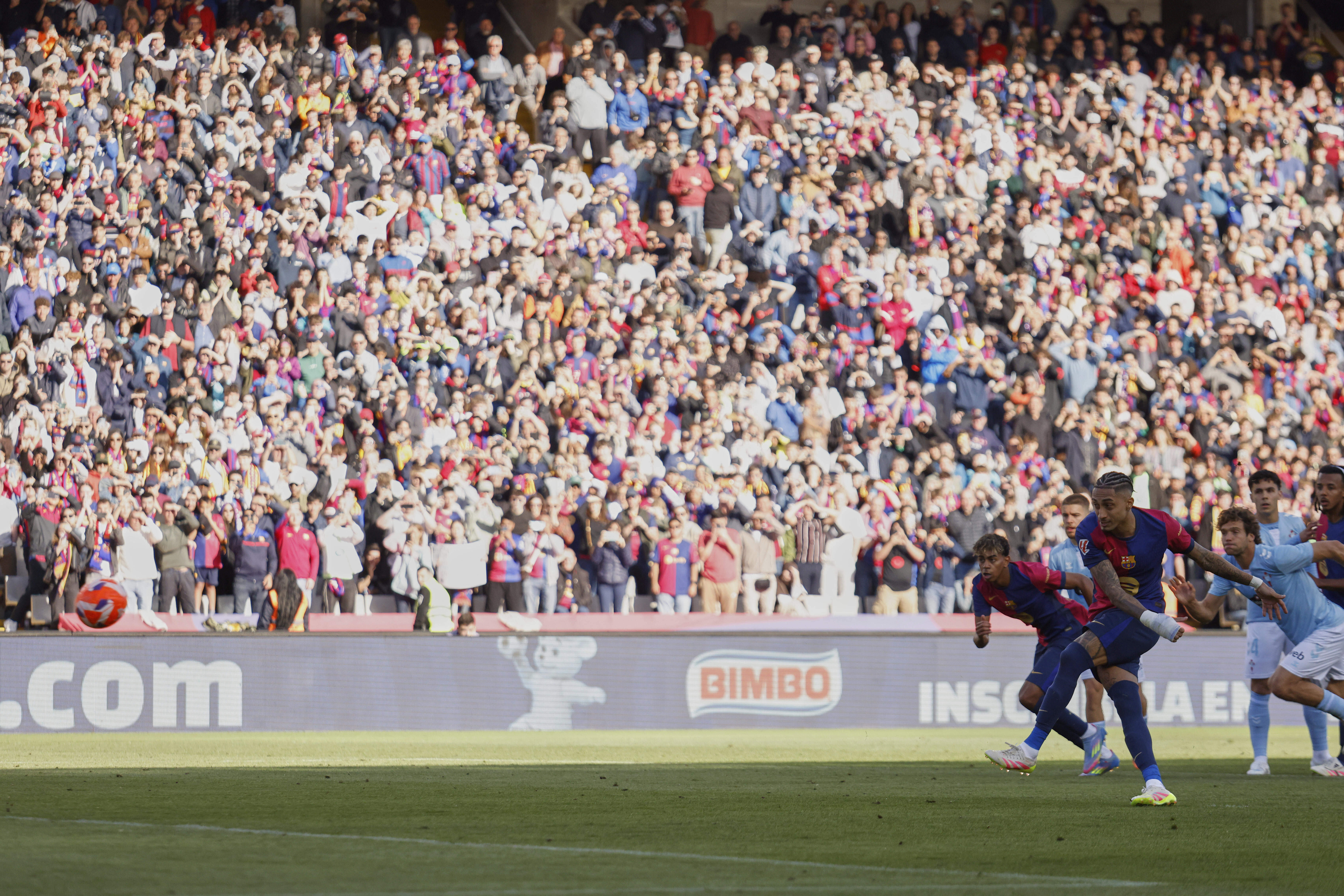 FILE -Barcelona's Raphinha shoots a penalty kick to score during a Spanish La Liga soccer match between Barcelona and Celta de Vigo at the Lluis Companys Olympic stadium in Barcelona, Spain, April 19, 2025. 