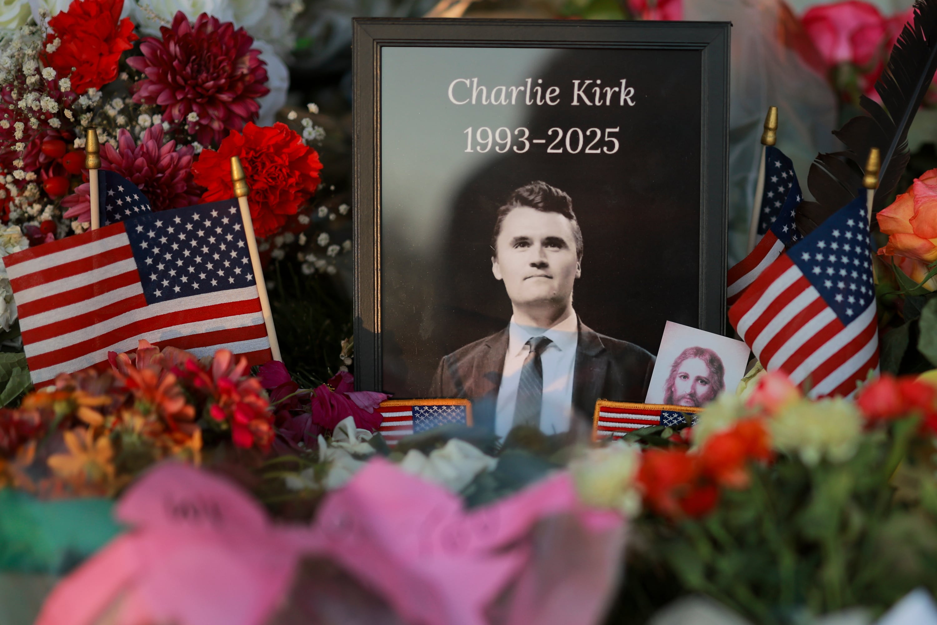 A photo of Charlie Kirk sits in a memorial at Utah Valley University in Orem on Sunday. The House on Friday passed a bipartisan resolution condemning Kirk's death and honoring "his life and legacy."