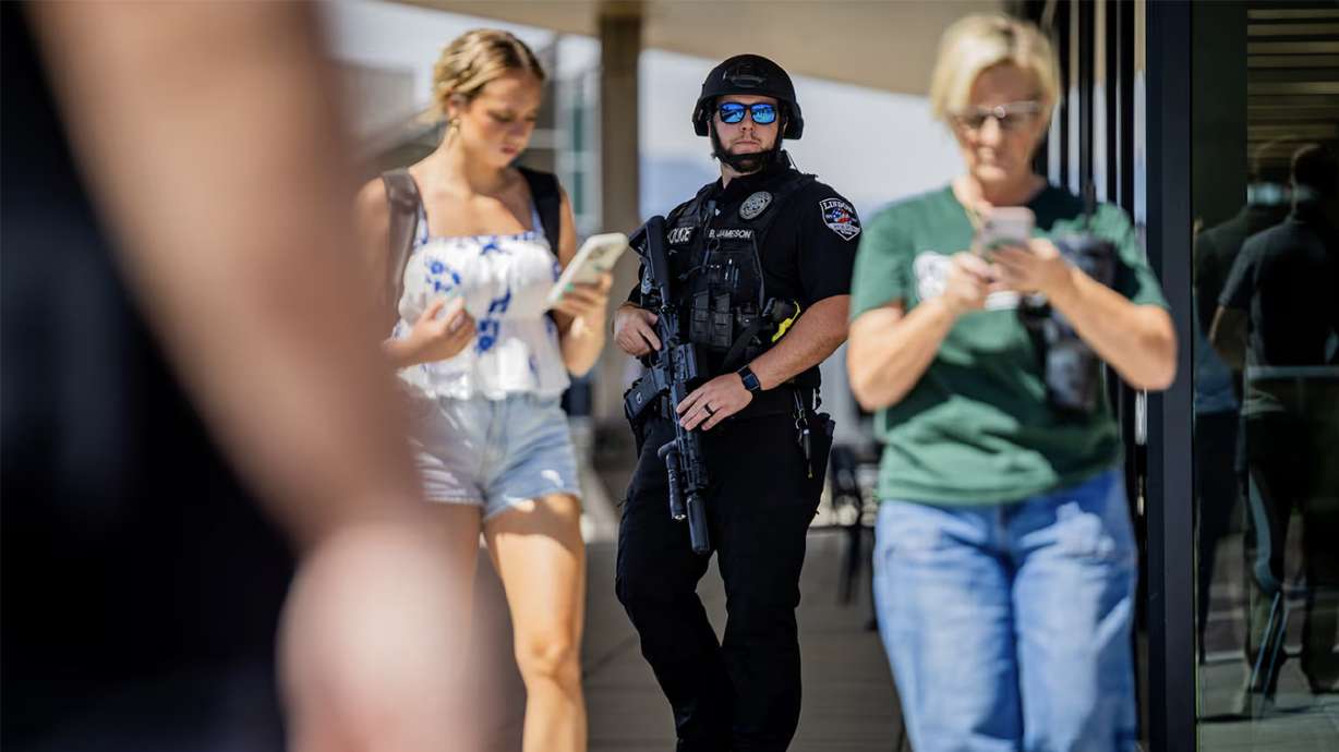 A member of the Lindon Police Department works the scene after Charlie Kirk was shot during a visit to Utah Valley University in Orem on Sept. 10. As UVU continues to review campus security and communication protocols, Utah State University is busy preparing for its own Turning Point USA gathering.