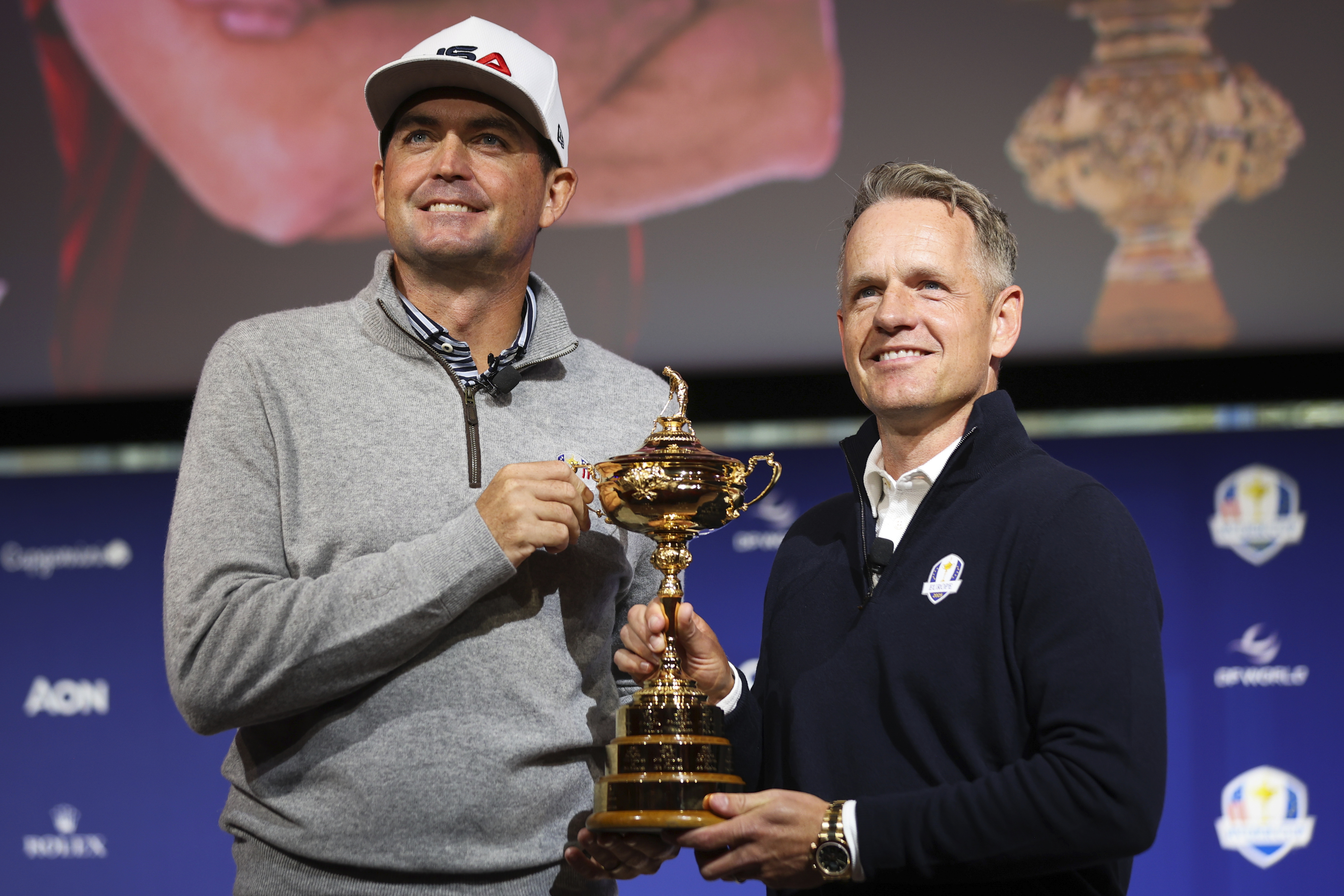 FILE - United States captain Keegan Bradley, left, and Europe captain Luke Donald pose for a photo with the Ryder Cup trophy after a press conference in New York, Tuesday, Oct. 8, 2024, in New York. (AP Photo/Heather Khalifa, File(