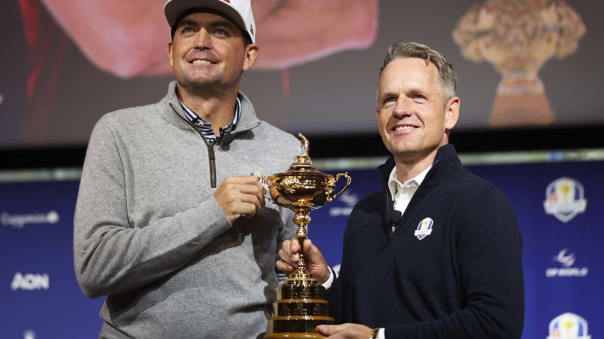 FILE - United States captain Keegan Bradley, left, and Europe captain Luke Donald pose for a photo with the Ryder Cup trophy after a press conference in New York, Tuesday, Oct. 8, 2024, in New York. (AP Photo/Heather Khalifa, File(