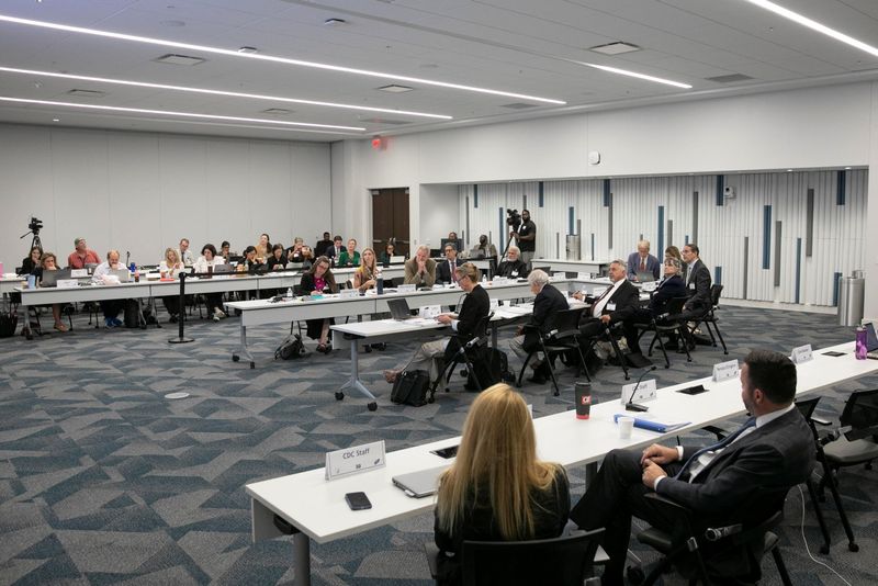 Vaccine advisers abandon broad COVID-19 shot support