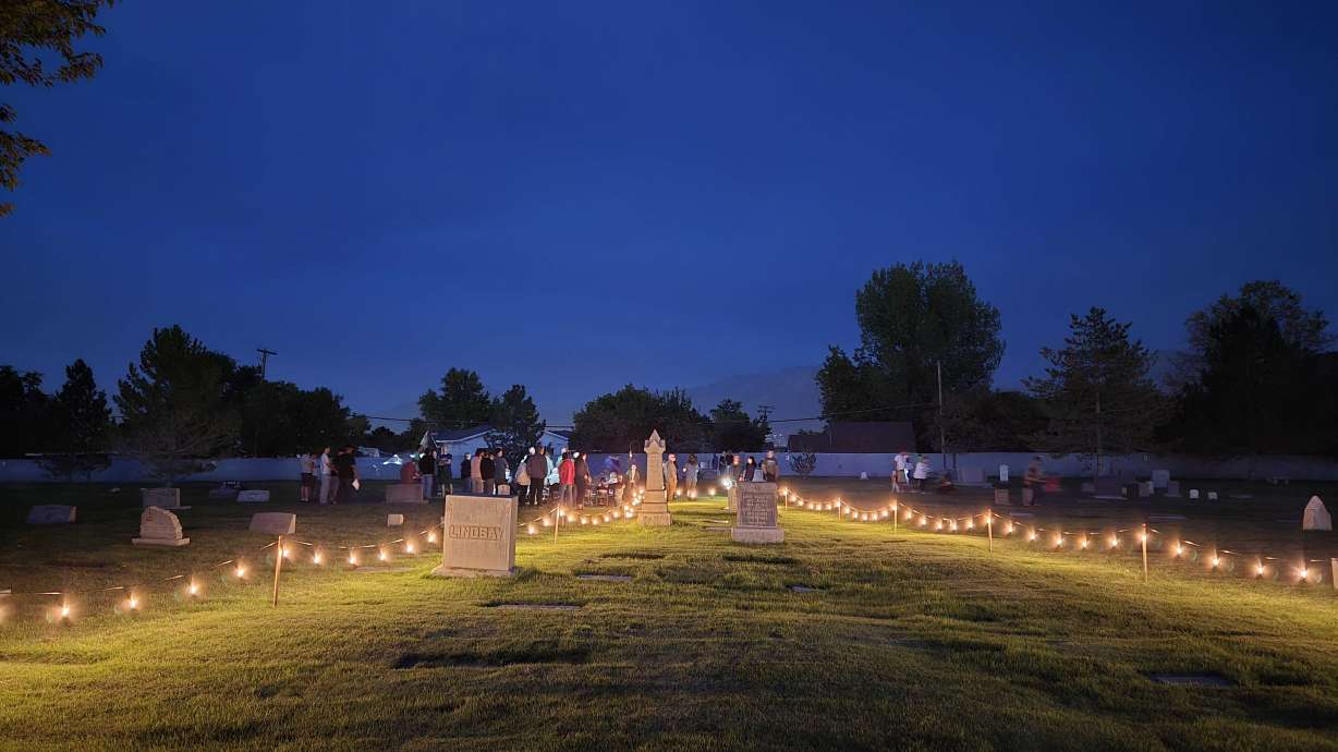 The Taylorsville Cemetery is lit up as attendees walk along the path from tomb to tomb, to listen to the stories at the city's Tombstone Tales event this weekend.