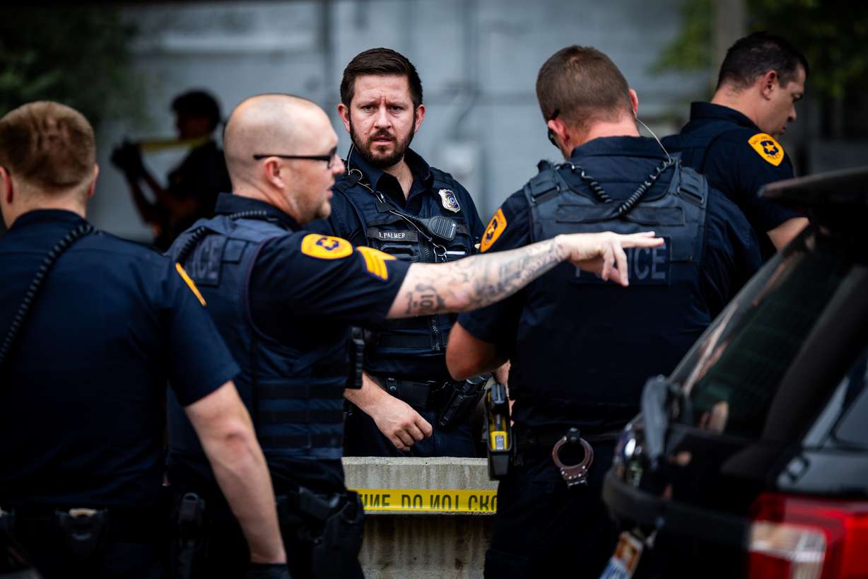 Salt Lake police officers work the scene after another police officer was attacked by a trespasser in an underpass at 550 W. 500 South in Salt Lake City on Friday.
