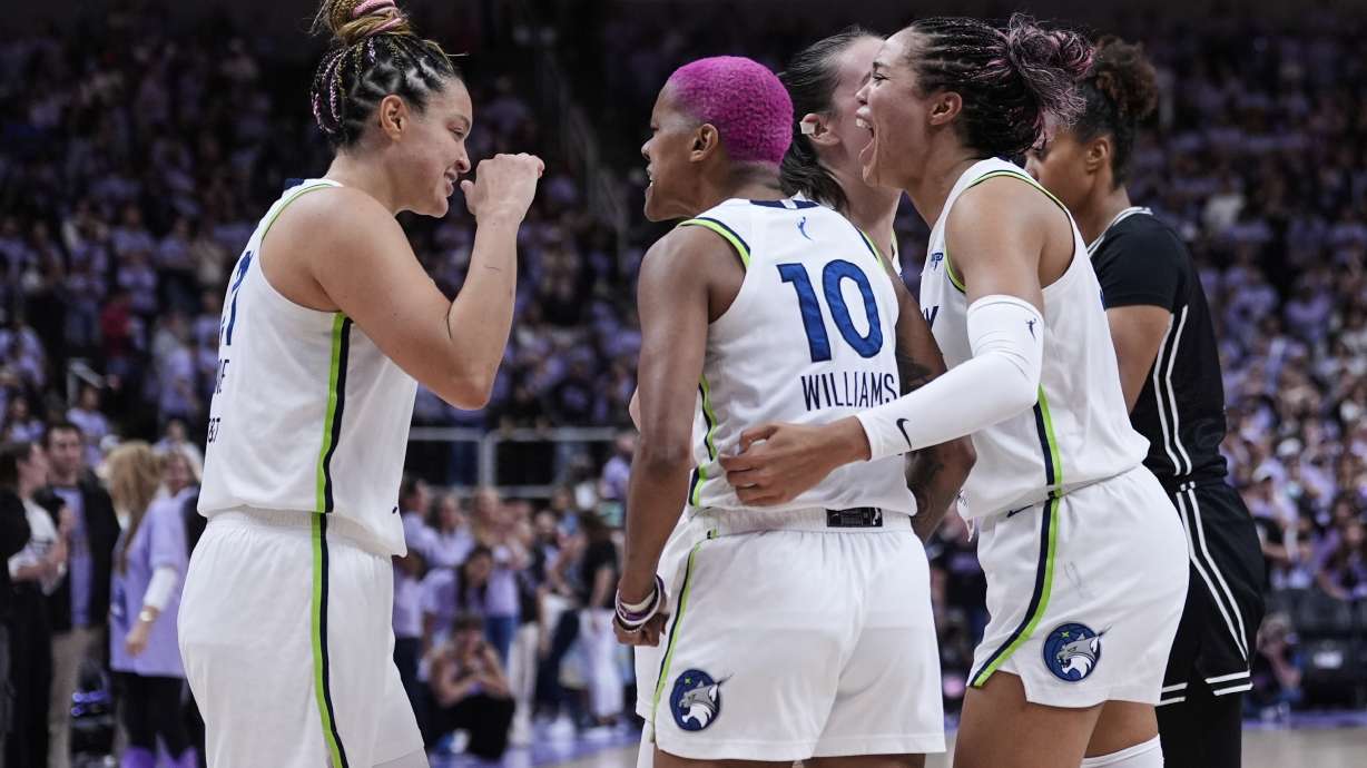 From left, Minnesota Lynx's Kayla McBride, Courtney Williams and Napheesa Collier celebrate after the team's victory over the Golden State Valkyries in the first round of the WNBA basketball playoffs Wednesday, Sept. 17, 2025, in San Jose, Calif.