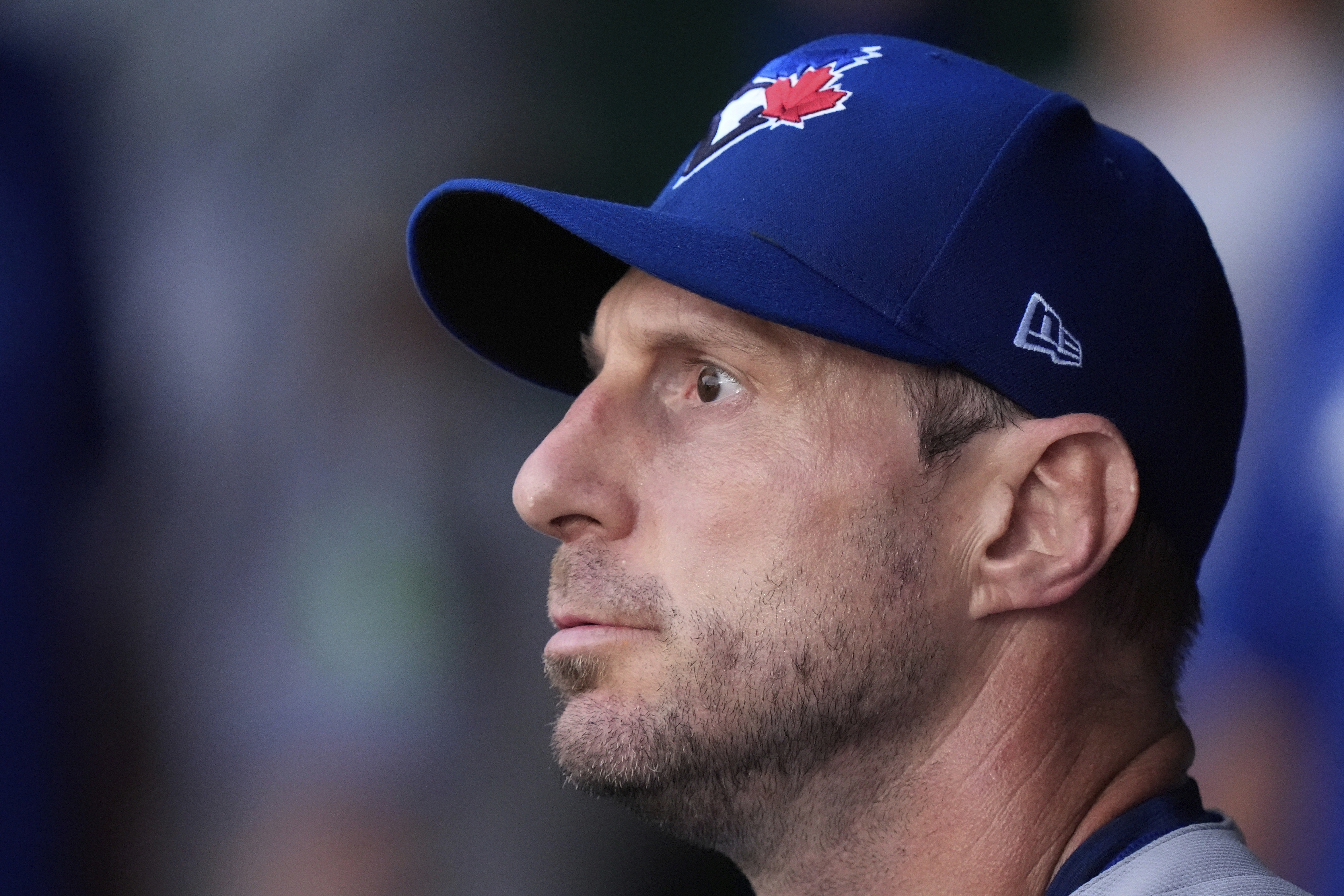 Toronto Blue Jays starting pitcher Max Scherzer watches from the dugout after coming out of the game during the first inning of a baseball game against the Kansas City Royals, Friday, Sept. 19, 2025, in Kansas City, Mo. 
