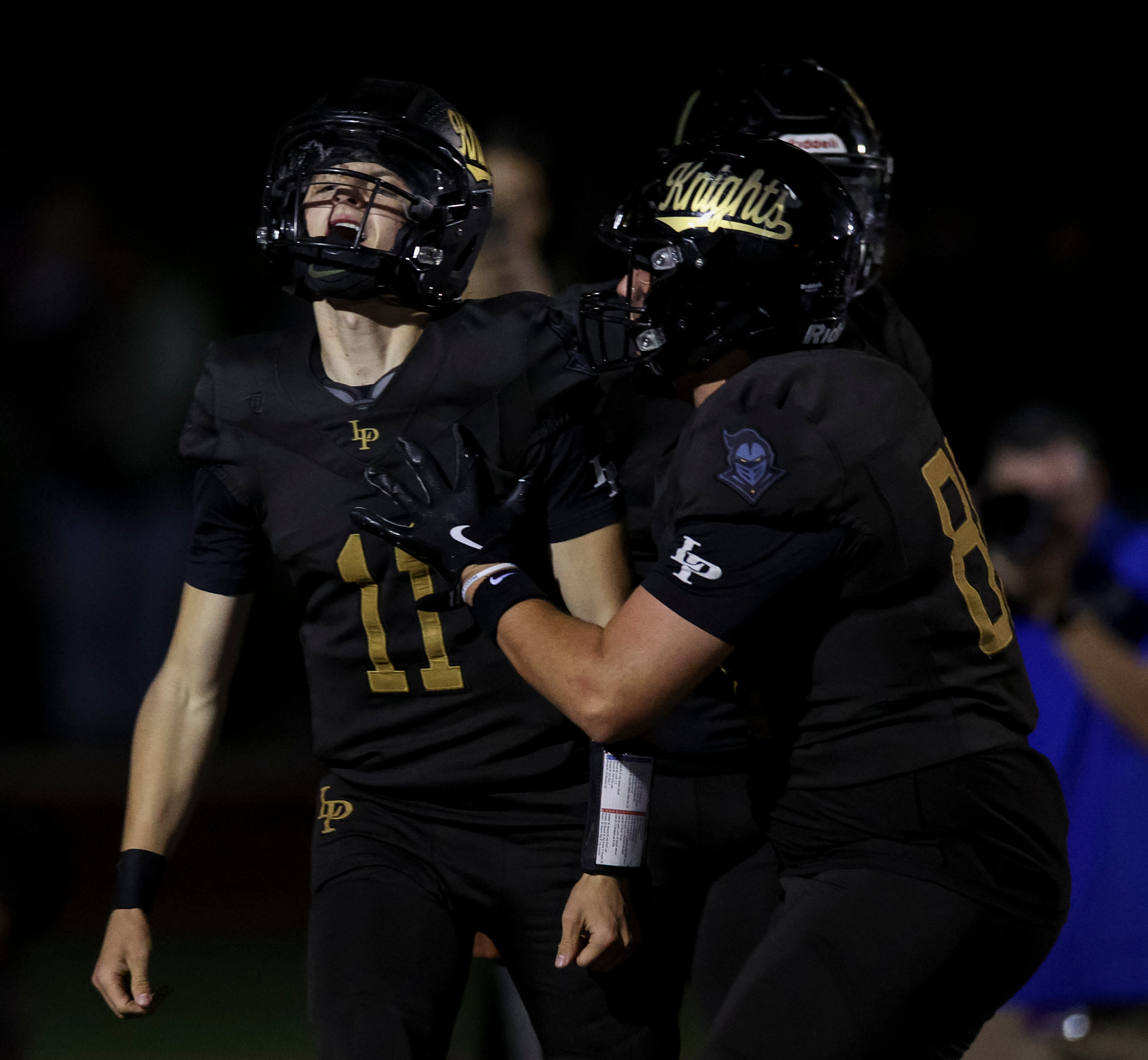 Lone Peak’s Cruz Christensen (11) lets out a yell after scoring a touchdown during the fourth quarter of a football game against Corner Canyon at Lone Peak High School in Highland on Friday, Sept. 19, 2025.