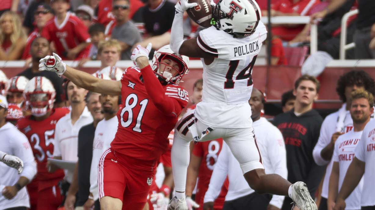 Texas Tech defensive back Brice Pollock intercepts a pass intended for Utah tight end JJ Buchanan during the first half of an NCAA college football game Saturday, Sept. 20, 2025, in Salt Lake City, Utah.