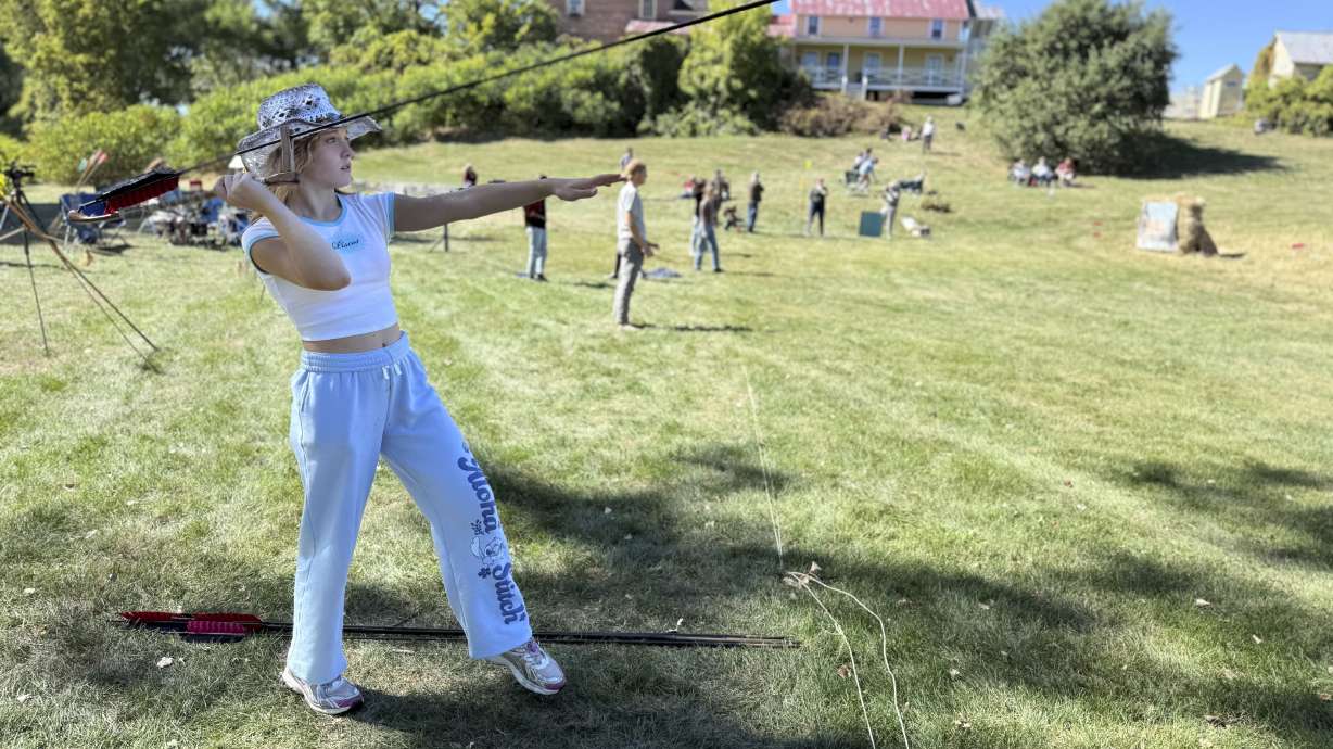12-year-old Ava Nolf of Clinton, Connecticut practices throwing an atlatl during the Northeastern Atlatl Championship in Addison, Vt. on Saturday, Sept. 20, 2025.
