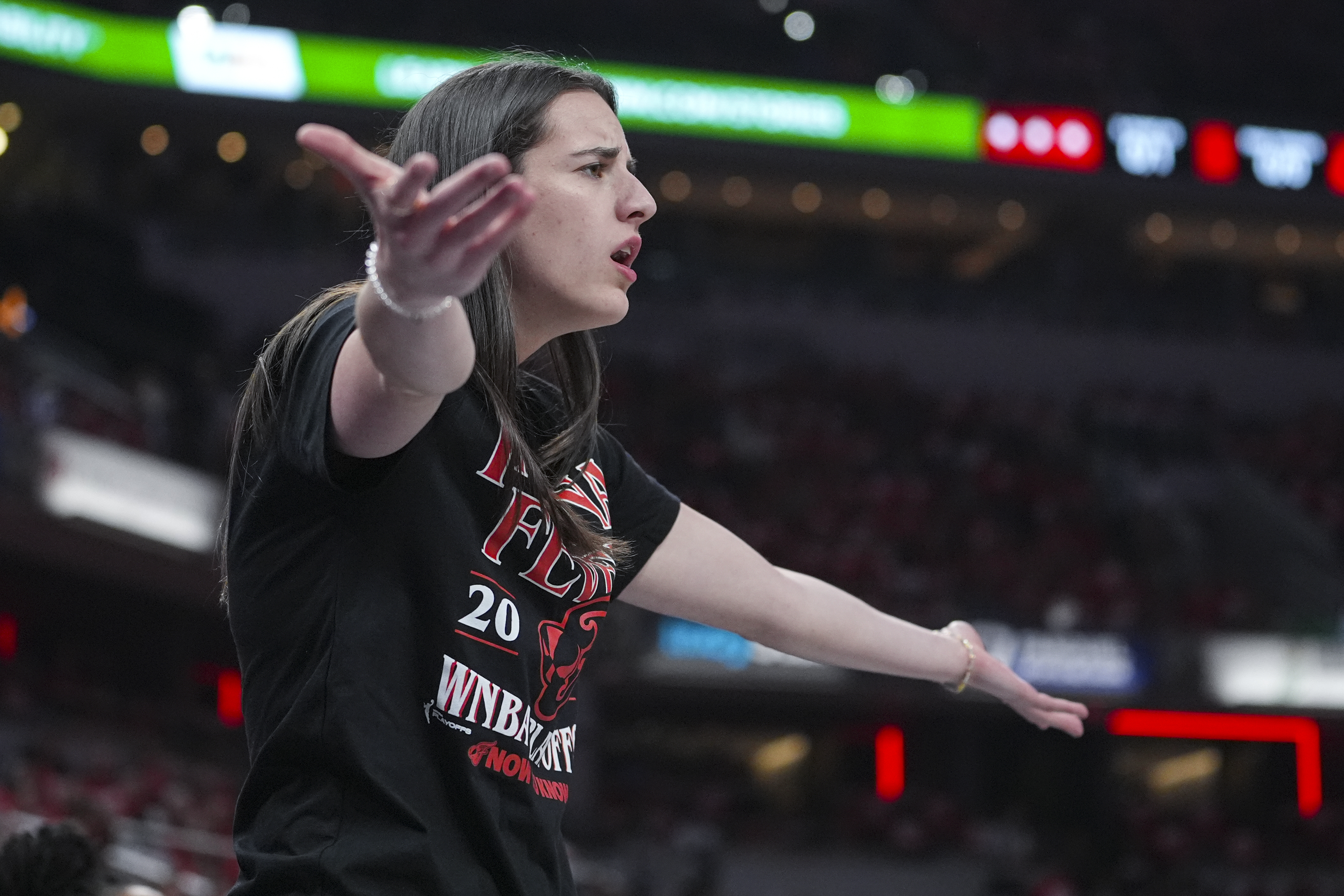 Indiana Fever guard Caitlin Clark (22) gestures on the bench in the first half of a WNBA basketball playoff game between the Indiana Fever and the Atlanta Dream in Indianapolis, Tuesday, Sept. 16, 2025. 