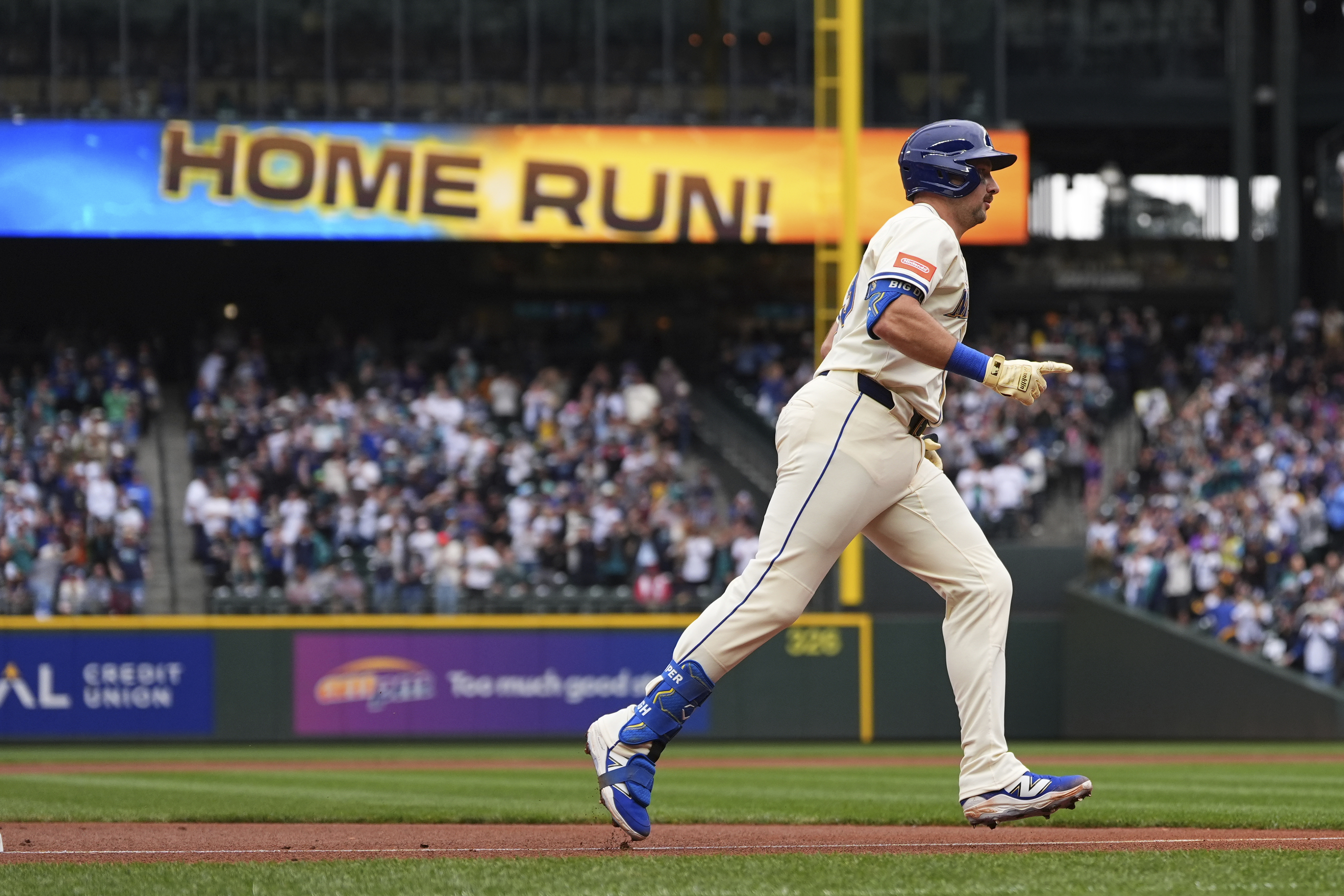 Seattle Mariners' Cal Raleigh jogs the bases after hitting his 54th home run of the season, a two-run home run to tie Mickey Mantle for most home runs by a switch-hitter in a single season, against the Los Angeles Angels during the first inning of a baseball game Sunday, Sept. 14, 2025, in Seattle. 