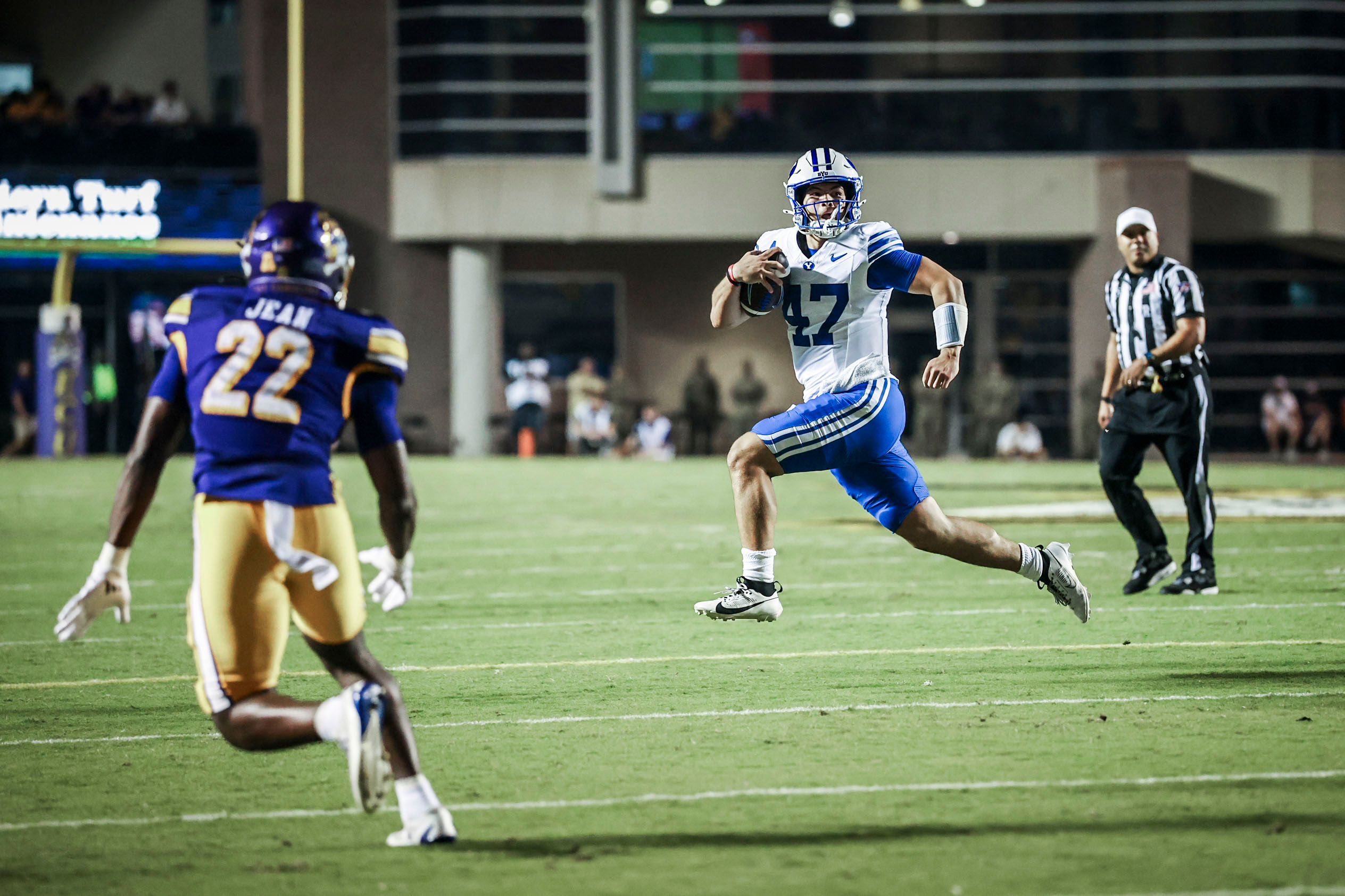 BYU quarterback Bear Bachmeier runs downfield during an NCAA college football game against East Carolina, Saturday, Sept. 20, 2025 in Greenville, N.C.