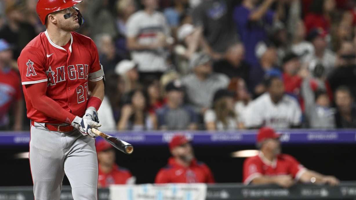 Los Angeles Angels designated hitter Mike Trout watches his hit clear the wall for a home run in the eighth inning against the Colorado Rockies on Saturday, Sept. 20, 2025, in Denver.