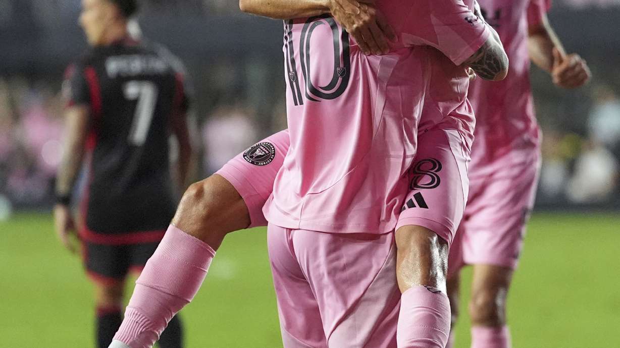 Inter Miami forward Lionel Messi (10) lifts defender Jordi Alba as he celebrates scoring his side's second goal against D.C. United during the second half of an MLS soccer match, Saturday, Sept. 20, 2025, in Fort Lauderdale, Fla.