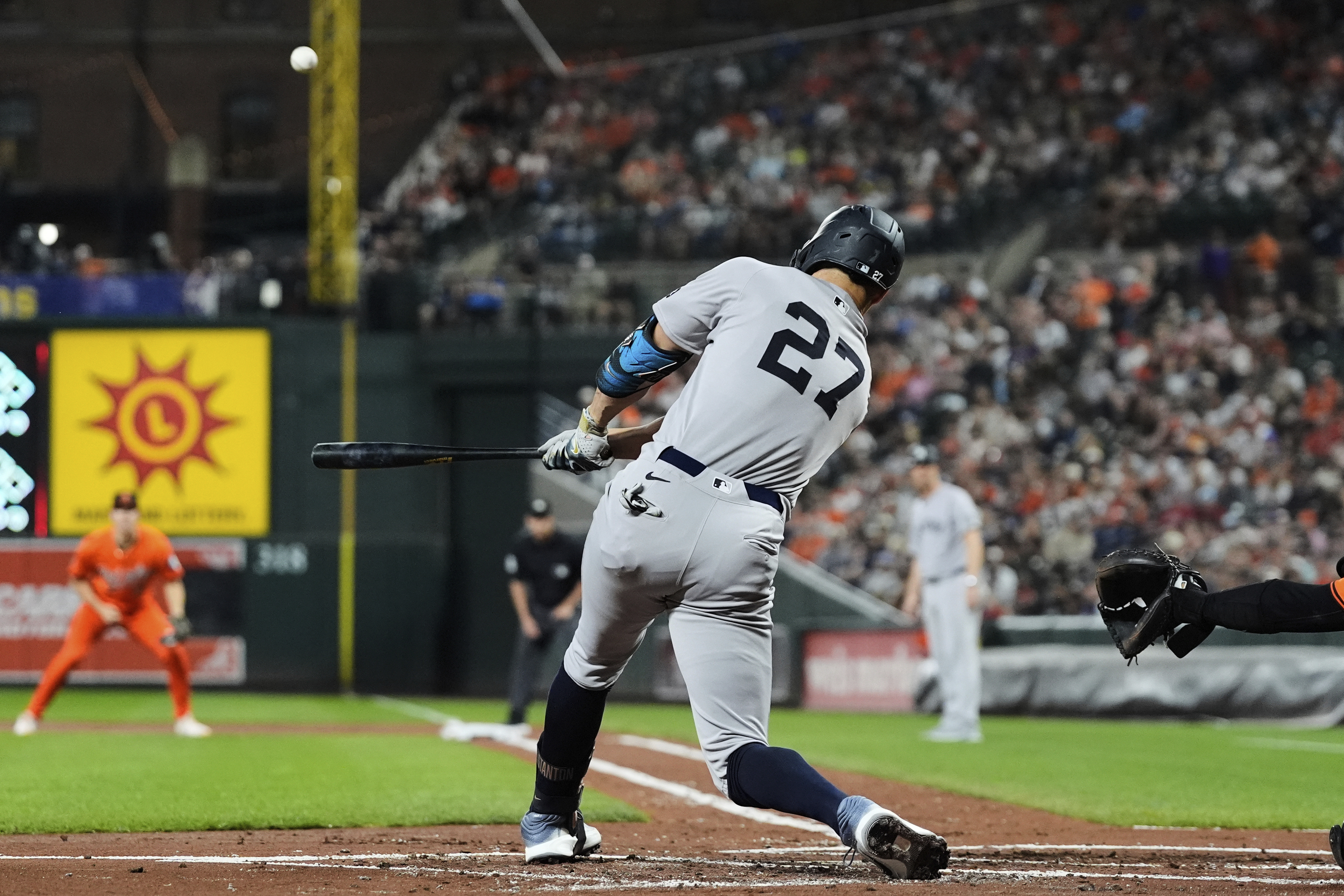 New York Yankees' Giancarlo Stanton hits a three-run home run during the first inning of a baseball game against the Baltimore Orioles, Saturday, Sept. 20, 2025, in Baltimore.