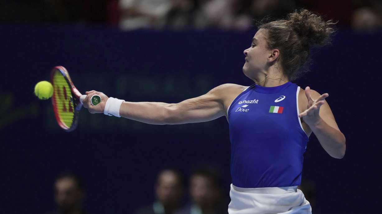 Jasmine Paolini, of Italy returns a forehand shot to Jessica Pegula, of the United States during the Billie Jean King Cup final tennis match, at the Shenzhen Bay Sports Center Arena, in Shenzhen, China's Guangdong province, Sunday, Sept. 21, 2025.