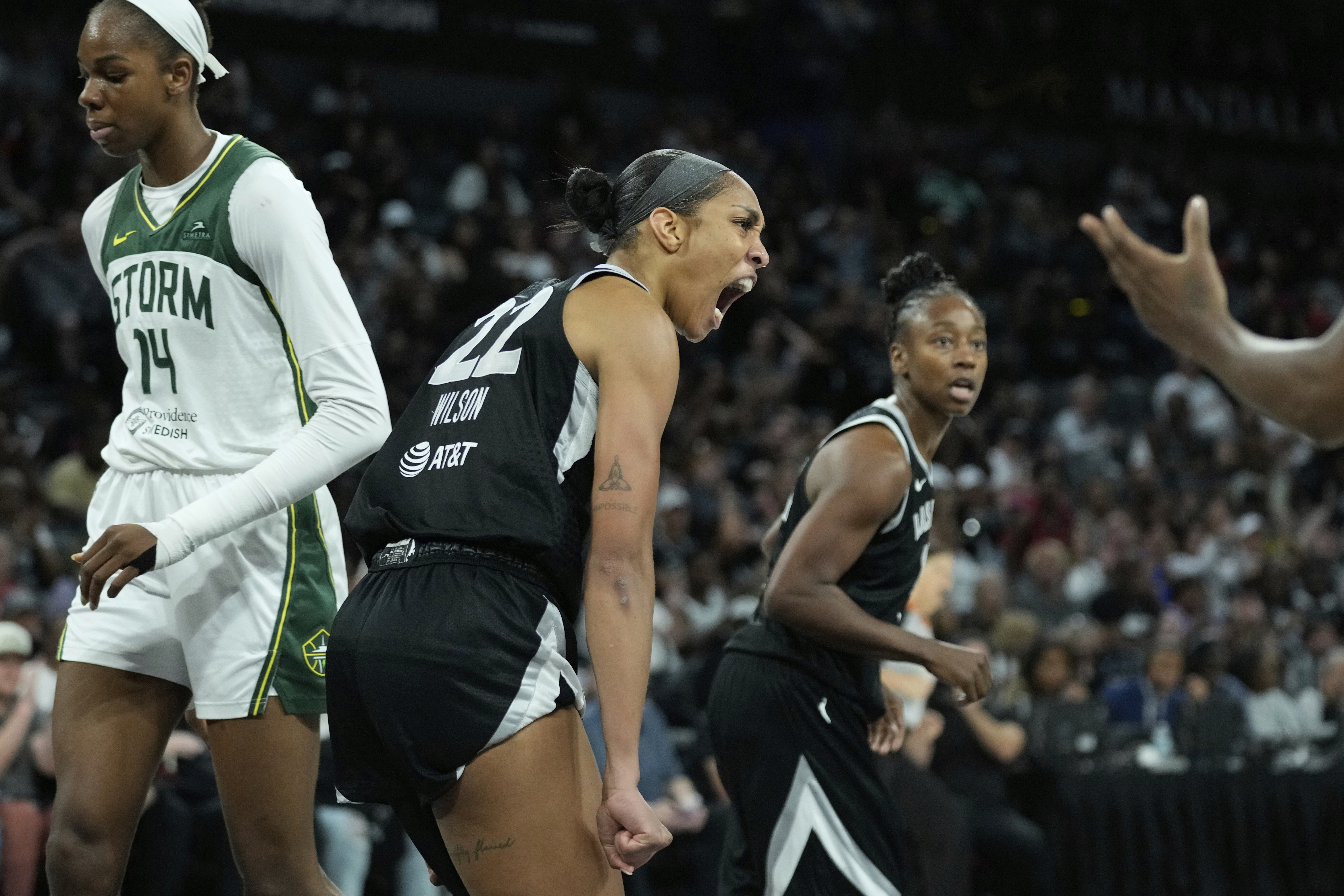 Las Vegas Aces center A'ja Wilson (22) celebrates after a play against the Seattle Storm during the second half of Game 3 in the first round of the WNBA basketball playoffs Thursday, Sept. 18, 2025, in Las Vegas. 