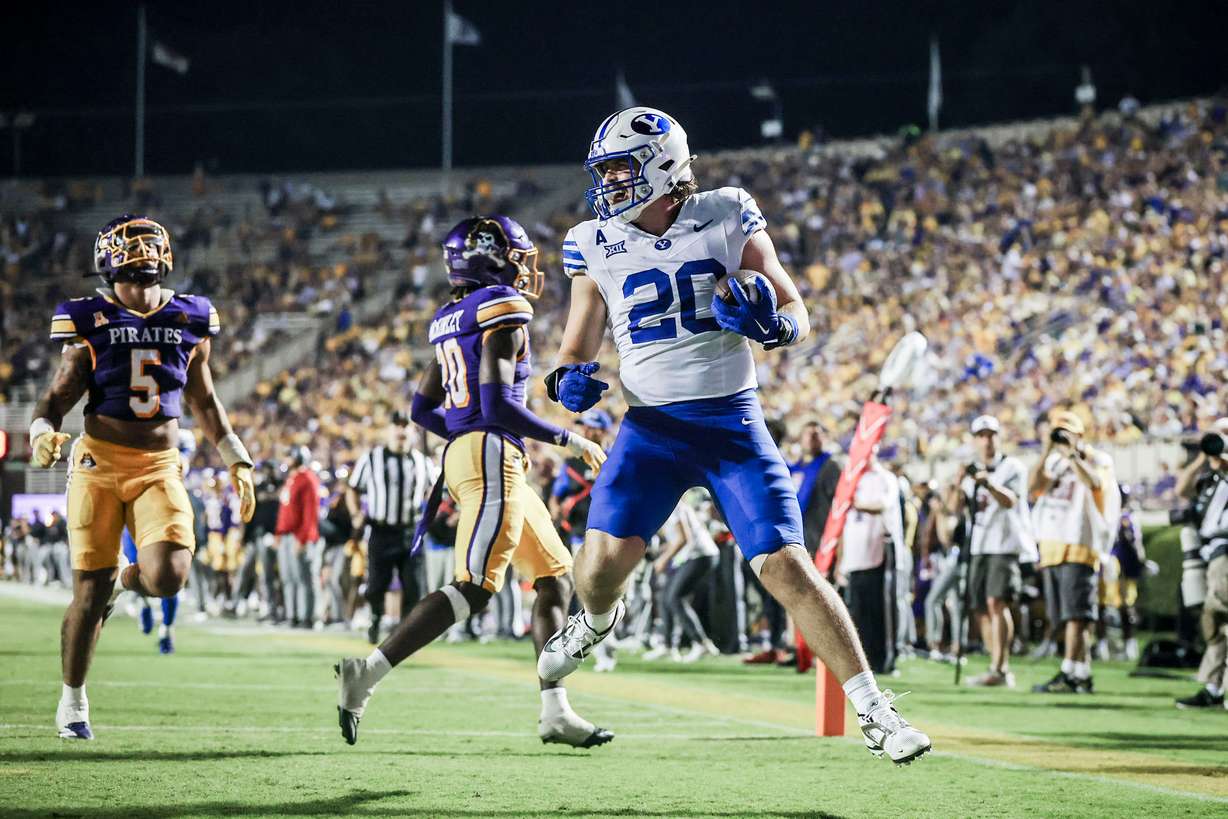 BYU tight end Carsen Ryan (20) celebrates a touchdown during an NCAA college football game against East Carolina, Saturday, Sept. 20, 2025 in Greenville, N.C.