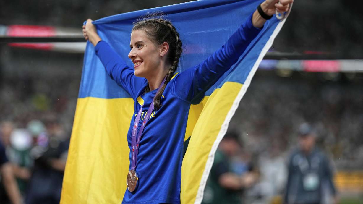 Ukraine's Yaroslava Mahuchikh celebrates taking the bronze in the women's high jump final at the World Athletics Championships in Tokyo, Sunday, Sept. 21, 2025.