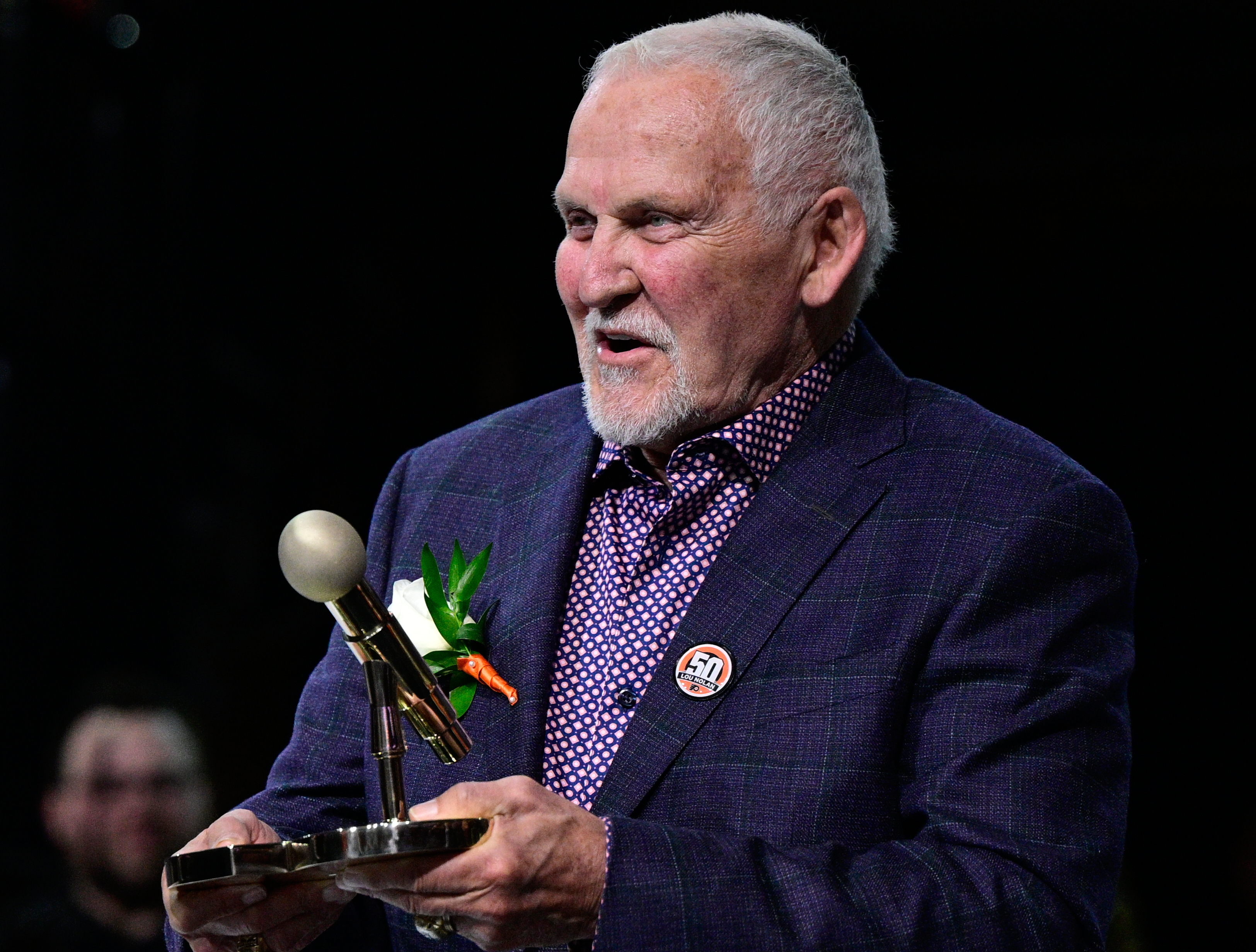 FILE - Former Philadelphia Flyers goalie Bernie Parent during a ceremony for public address announcer Lou Nolan prior to an NHL hockey game against the Anaheim Ducks, Saturday, April 9, 2022, in Philadelphia.