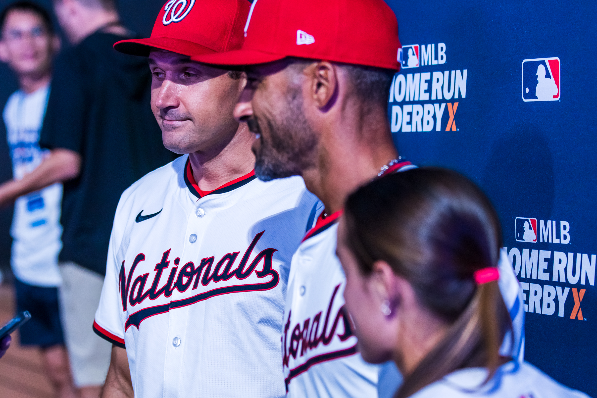 Ryan Zimmerman, left, Ian Desmond, center, and Ali Newland, right, answer questions in dugout after winning a quarterfinal matchup of Home Run Derby X at The Ballpark at America First Square on Friday.