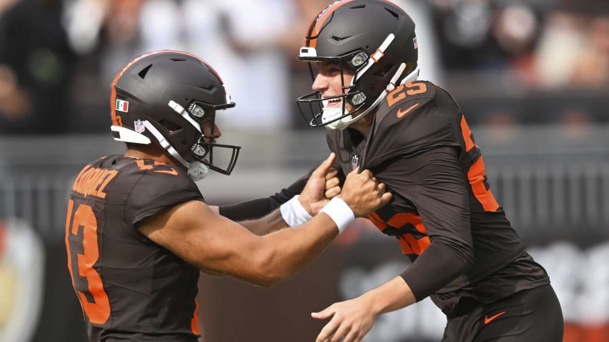 Cleveland Browns' Andre Szmyt celebrates his game-winning field goal with Corey Bojorquez during the second half of an NFL football game against the Green Bay Packers Sunday, Sept. 21, 2025, in Cleveland.