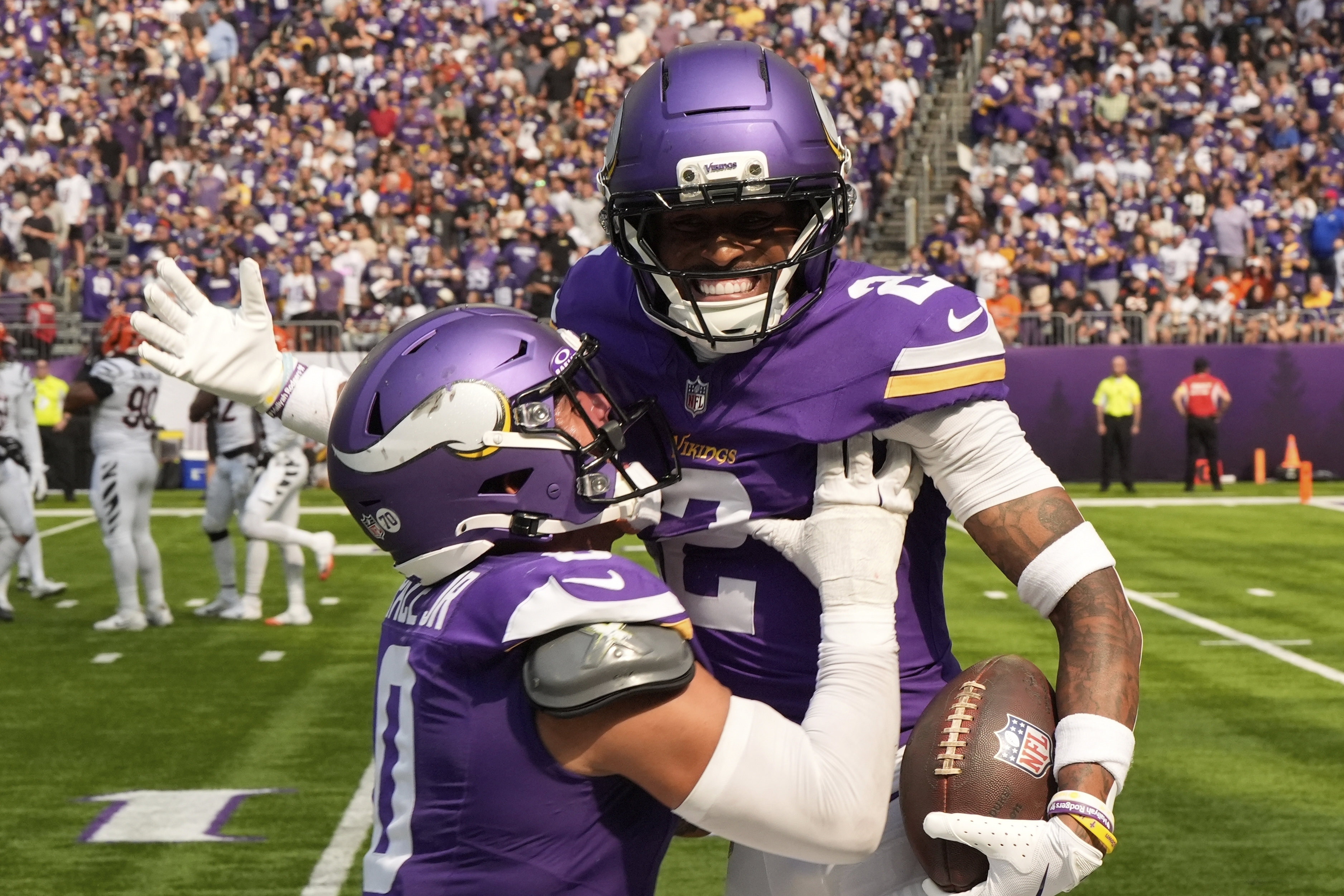 Minnesota Vikings cornerback Isaiah Rodgers (2) celebrates his touchdown with linebacker Ivan Pace Jr. during the first half of an NFL football game against the Cincinnati Bengals, Sunday, Sept. 21, 2025, in Minneapolis.