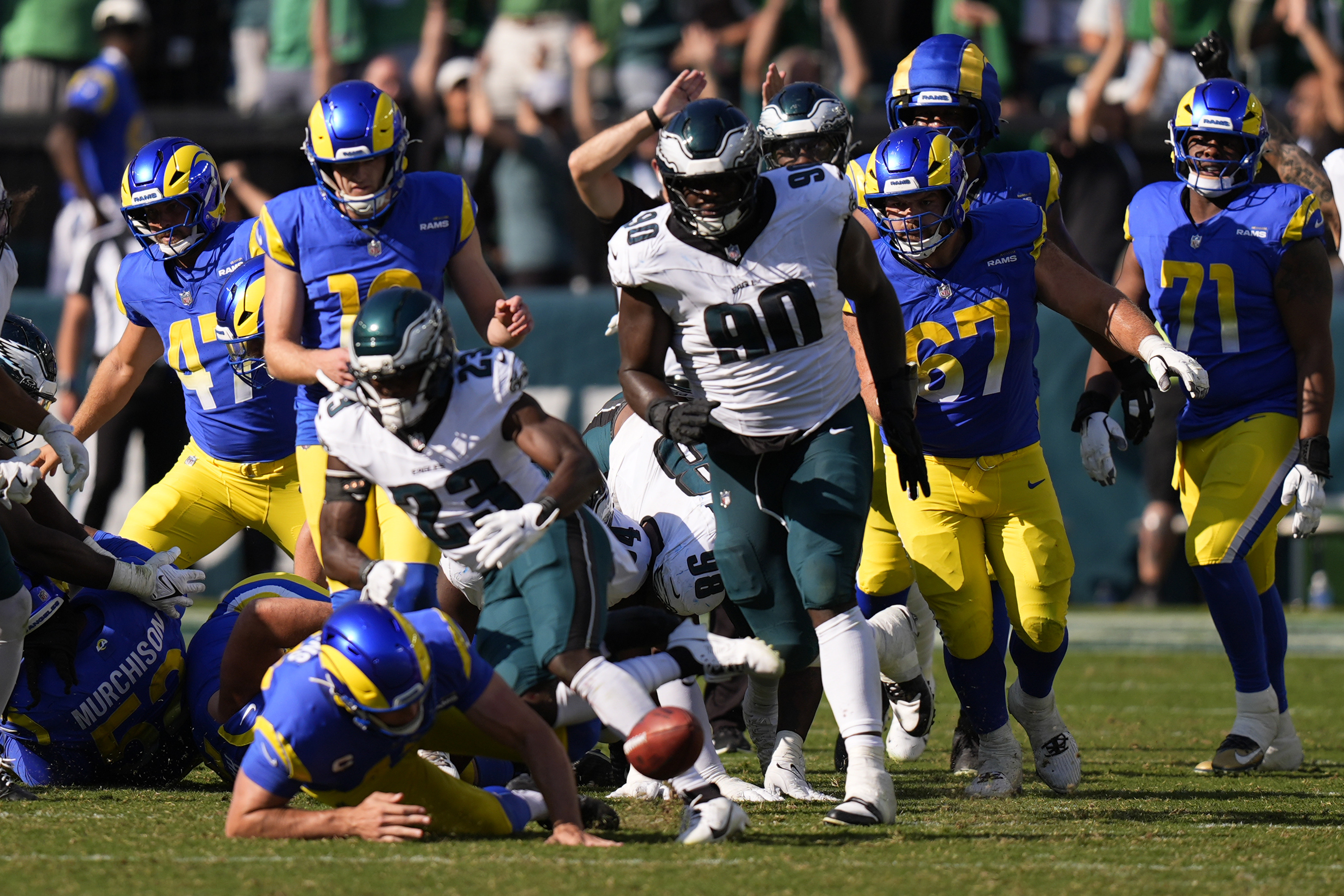 Philadelphia Eagles defensive tackle Jordan Davis (90) blocks a field goal attempt by Los Angeles Rams kicker Joshua Karty (16) before running the ball back for a touchdown as time expires during the second half of an NFL football game against the Los Angeles Rams Sunday, Sept. 21, 2025, in Philadelphia. 