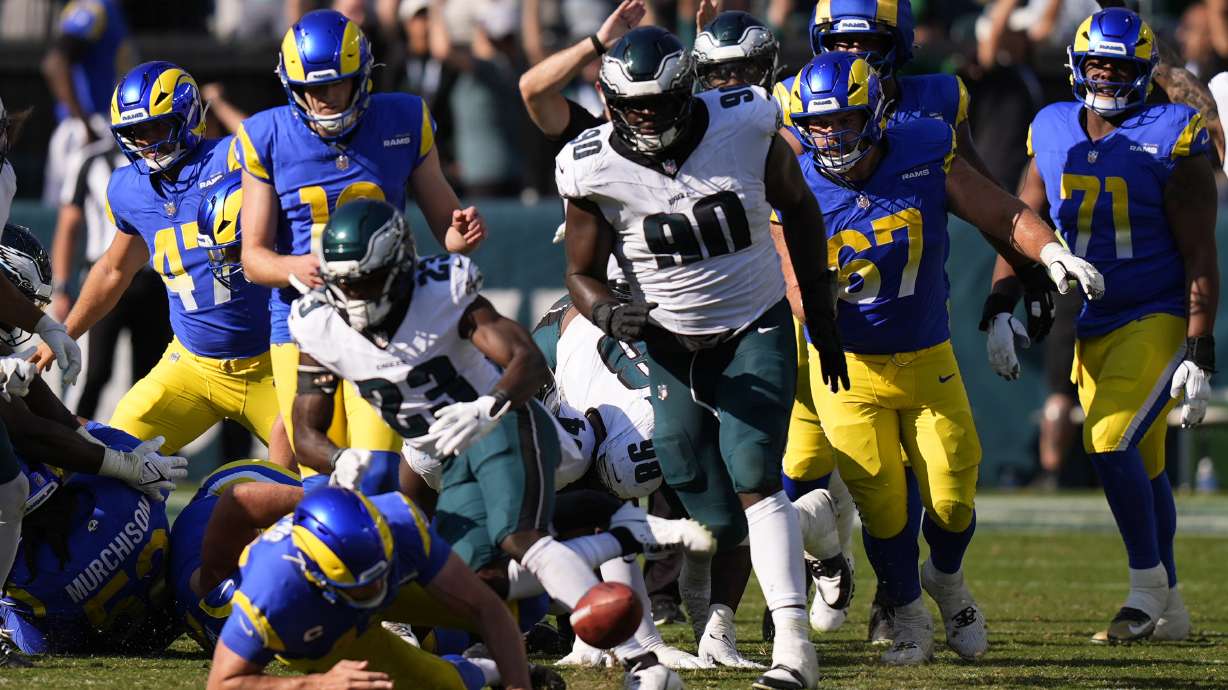 Philadelphia Eagles defensive tackle Jordan Davis (90) blocks a field goal attempt by Los Angeles Rams kicker Joshua Karty (16) before running the ball back for a touchdown as time expires during the second half of an NFL football game against the Los Angeles Rams Sunday, Sept. 21, 2025, in Philadelphia.