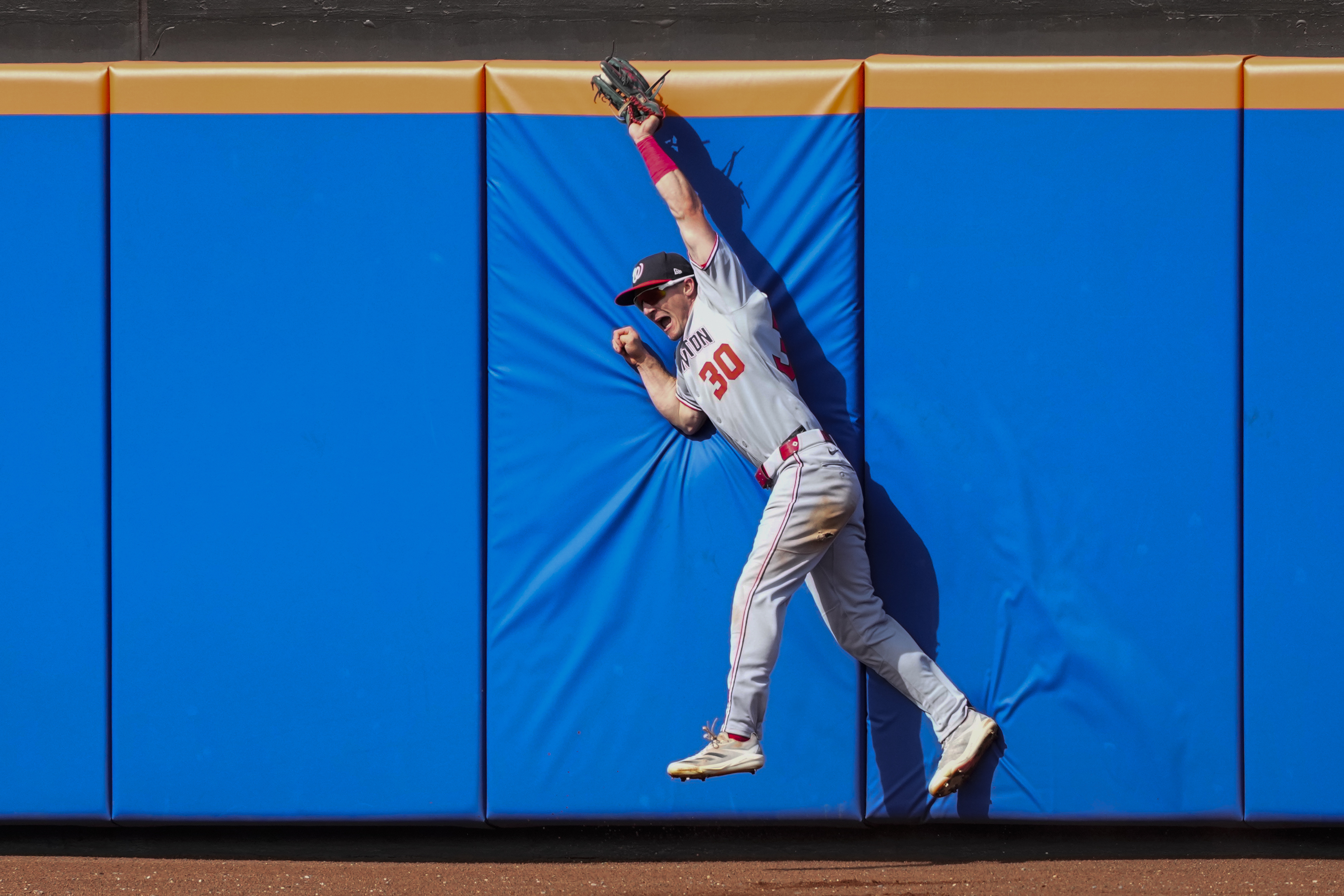 Washington Nationals outfielder Jacob Young catches a fly ball hit by New York Mets' Brett Baty during the fifth inning of a baseball game Sunday, Sept. 21, 2025, in New York.