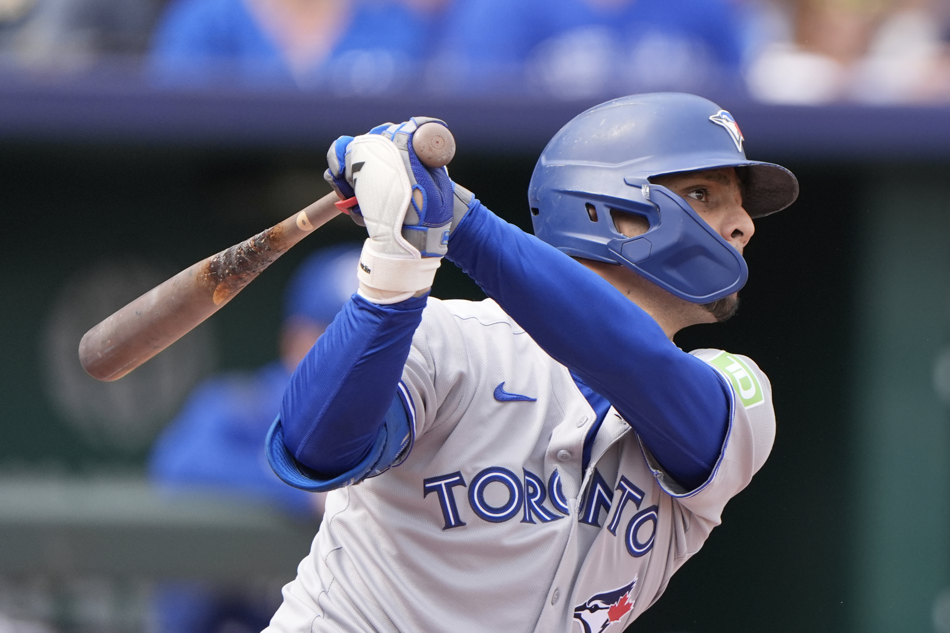 Toronto Blue Jays' Andres Gimenez watches his RBI single during the second inning of a baseball game against the Kansas City Royals, Sunday, Sept. 21, 2025, in Kansas City, Mo.