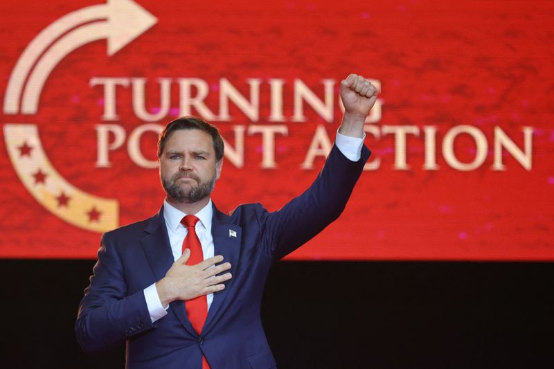 U.S. Vice President JD Vance pumps a fist after speaking during a memorial service for slain conservative commentator Charlie Kirk at State Farm Stadium, Arizona, Sunday.