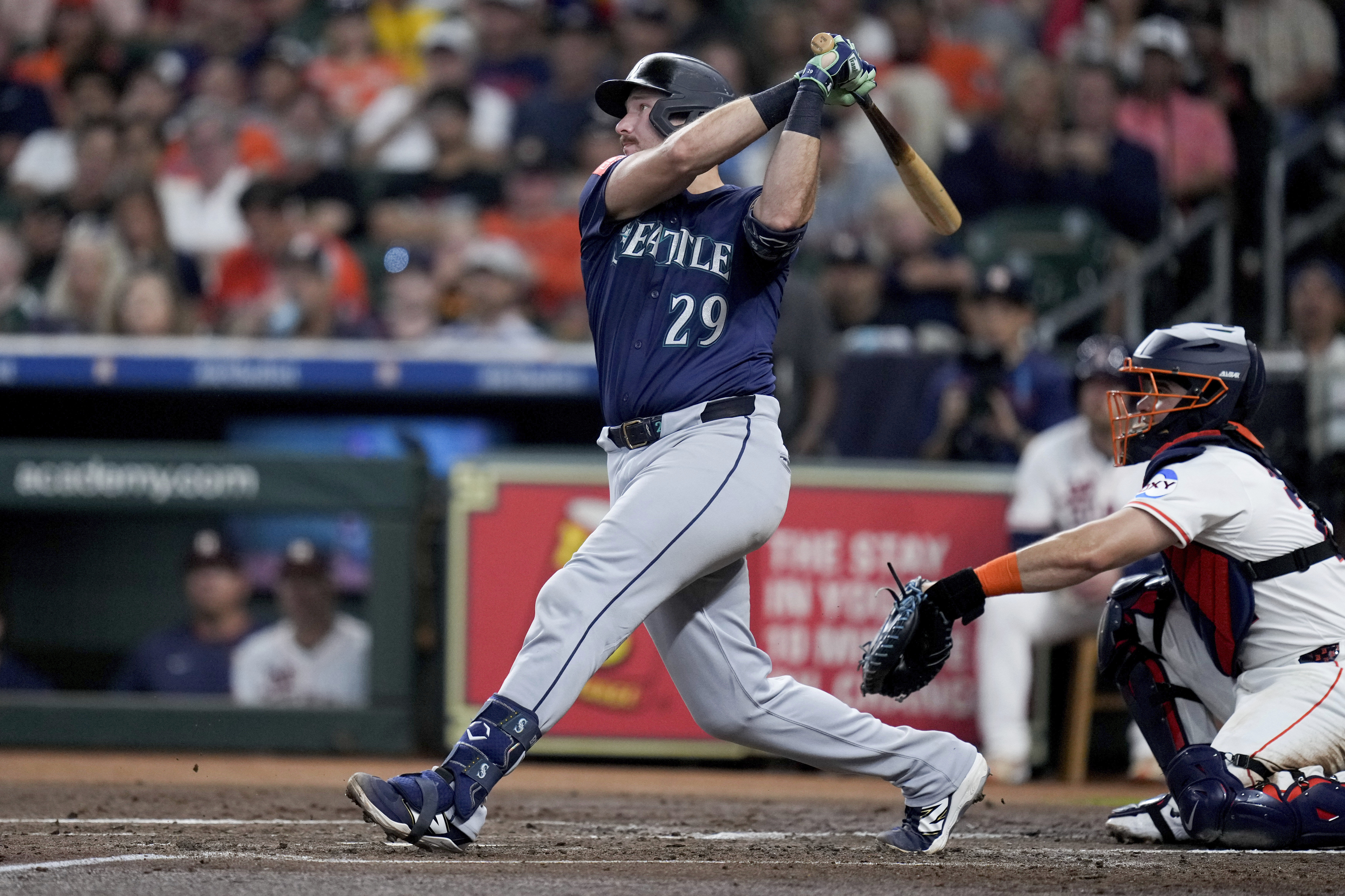 Seattle Mariners' Cal Raleigh (29) hits a solo home run, his 57th of the season, against the Houston Astros during the third inning of a baseball game Saturday, Sept. 20, 2025, in Houston. 