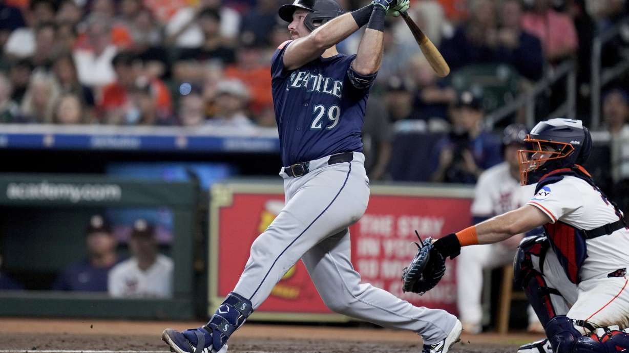 Seattle Mariners' Cal Raleigh (29) hits a solo home run, his 57th of the season, against the Houston Astros during the third inning of a baseball game Saturday, Sept. 20, 2025, in Houston.