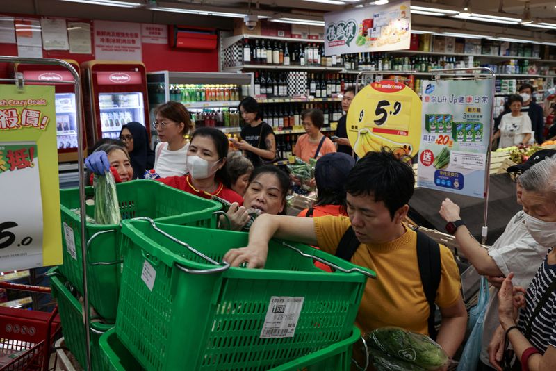 Residents stock up on supplies at a supermarket to prepare for the approaching Typhoon Ragasa, in Hong Kong, China, Monday.