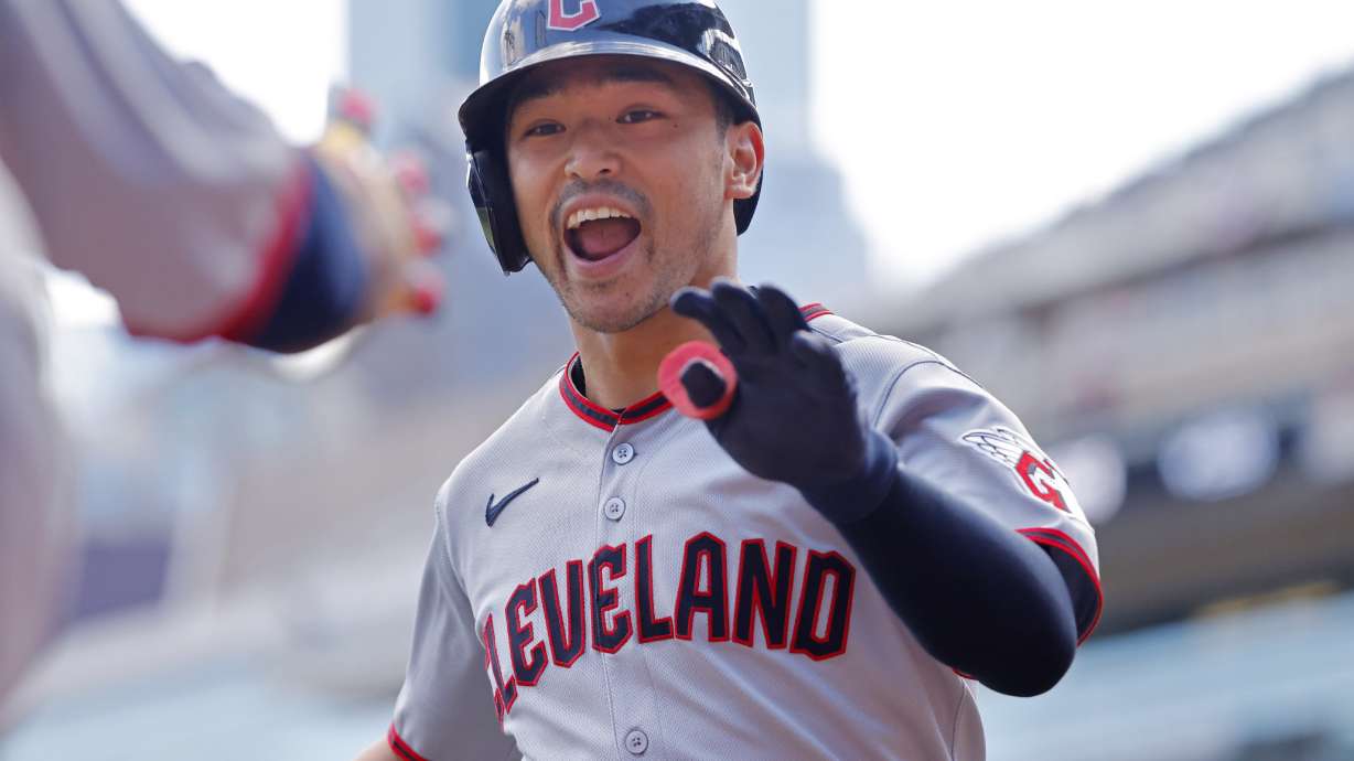 Cleveland Guardians' Steven Kwan celebrates after his leadoff home run against the Minnesota Twins in the first inning of a baseball game Sunday, Sept. 21, 2025, in Minneapolis.