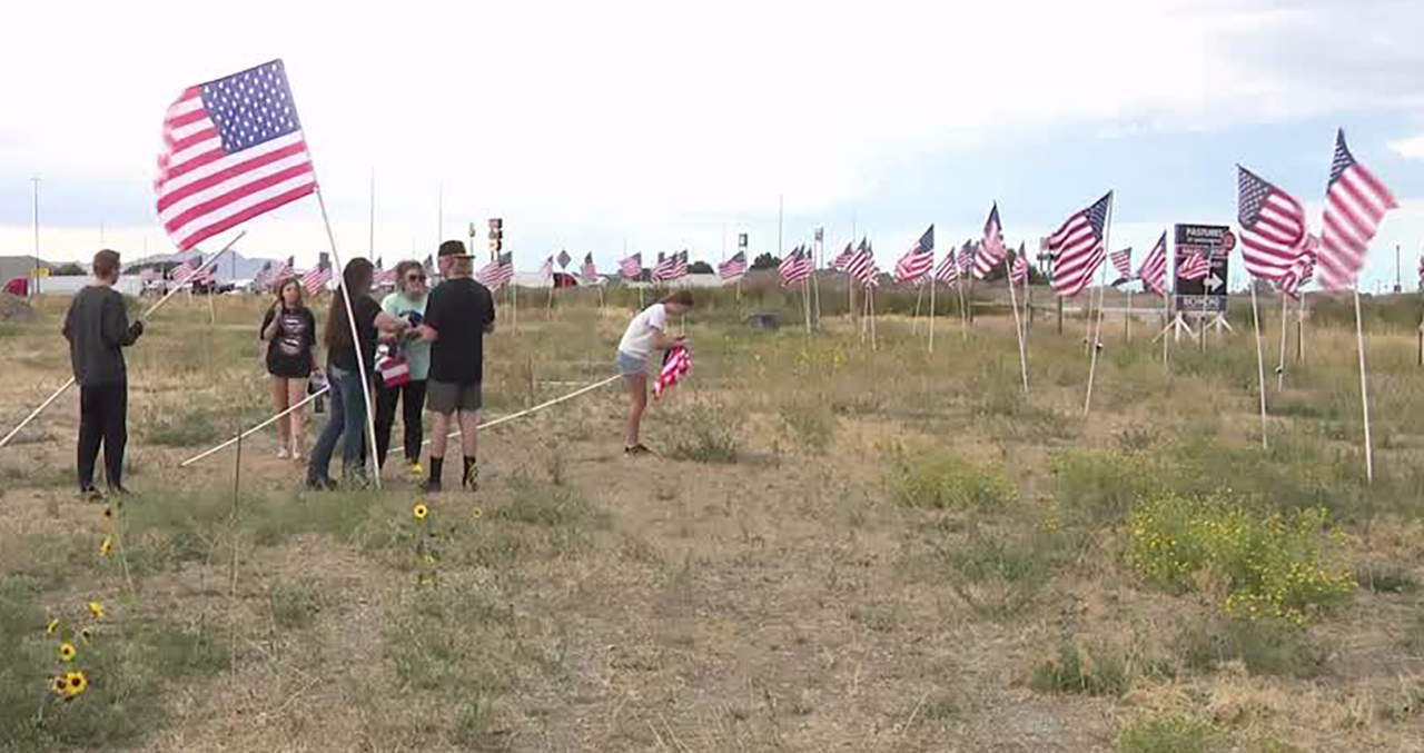 Volunteers restore flags to a 9/11 healing field in Tooele County on Sunday. Leaders of a nonprofit organization report several flags were stolen from the field recently.