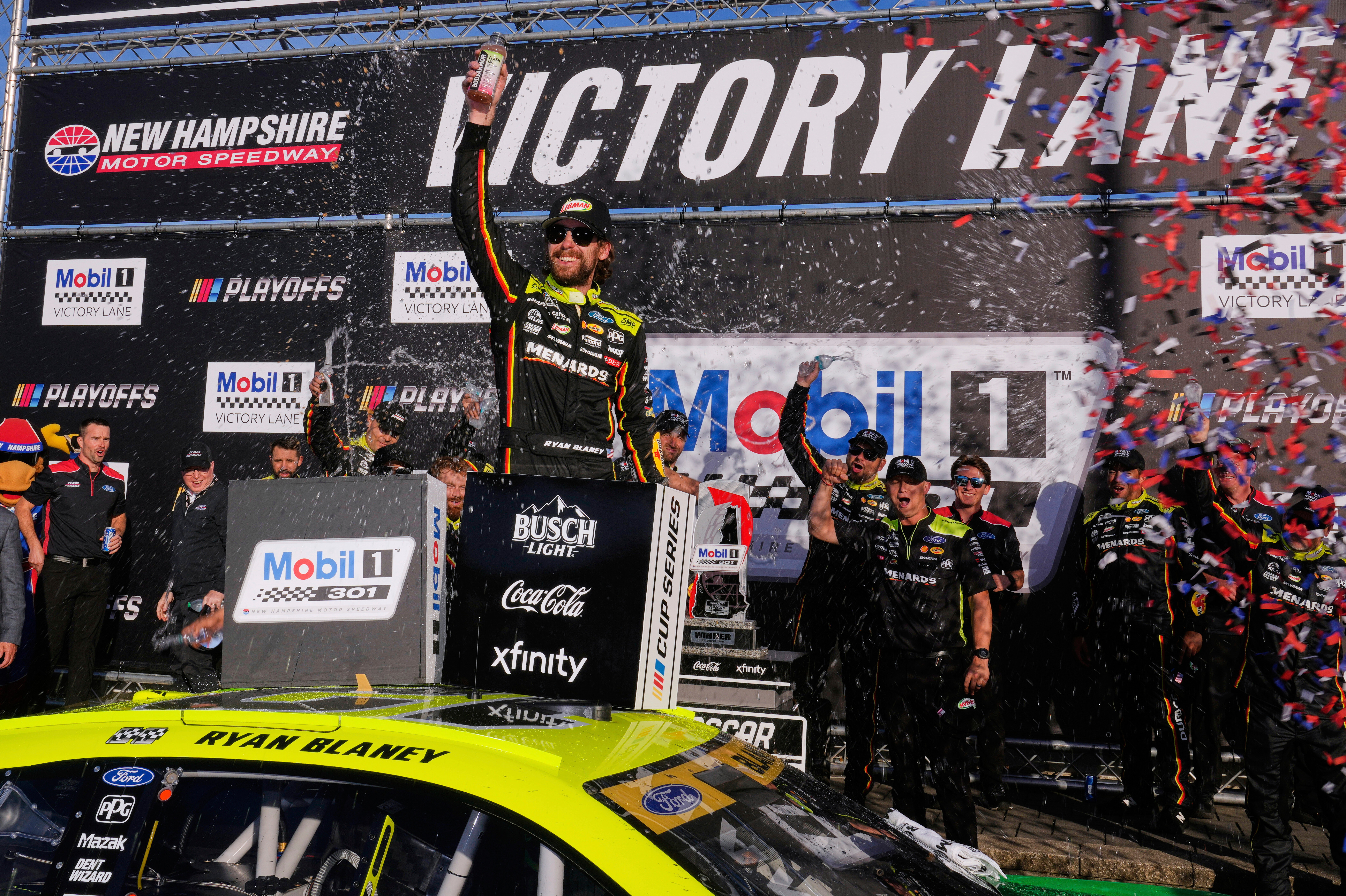 Ryan Blaney, center, celebrates in Victory Lane after winning a NASCAR Cup Series race at New Hampshire Motor Speedway, Sunday, Sept. 21, 2025, in Loudon, N.H.
