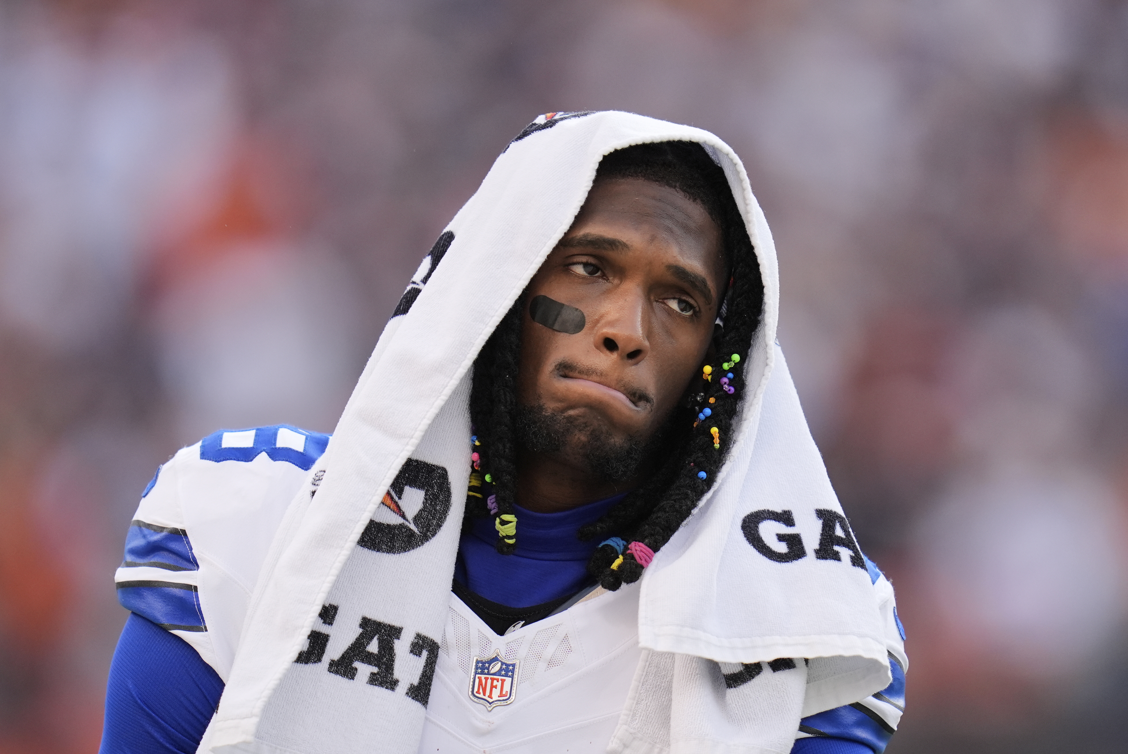 Dallas Cowboys wide receiver CeeDee Lamb walks along the sideline in the second half of an NFL football game against the Chicago Bears Sunday, Sept. 21, 2025, in Chicago.